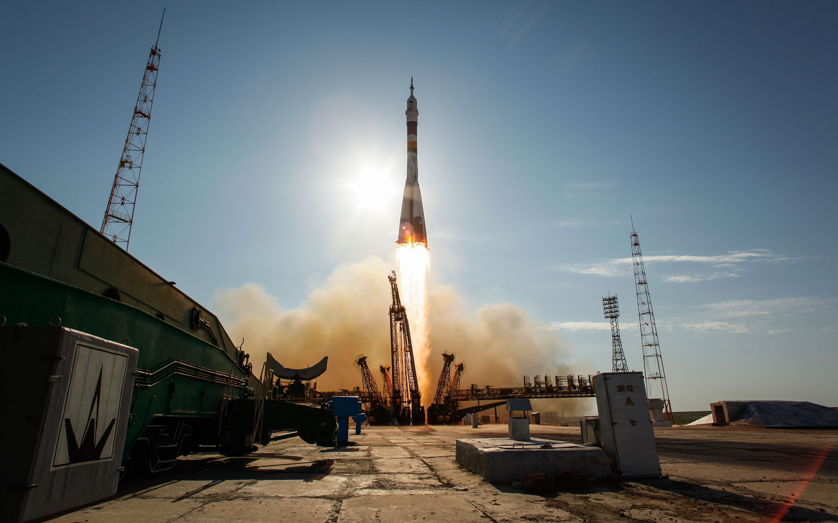 building exterior, mode of transportation, factory, lens flare, incidental people, day, outdoors, sky, soyuz, industry, lifestyles, tall - high, the way forward, HD Wallpaper