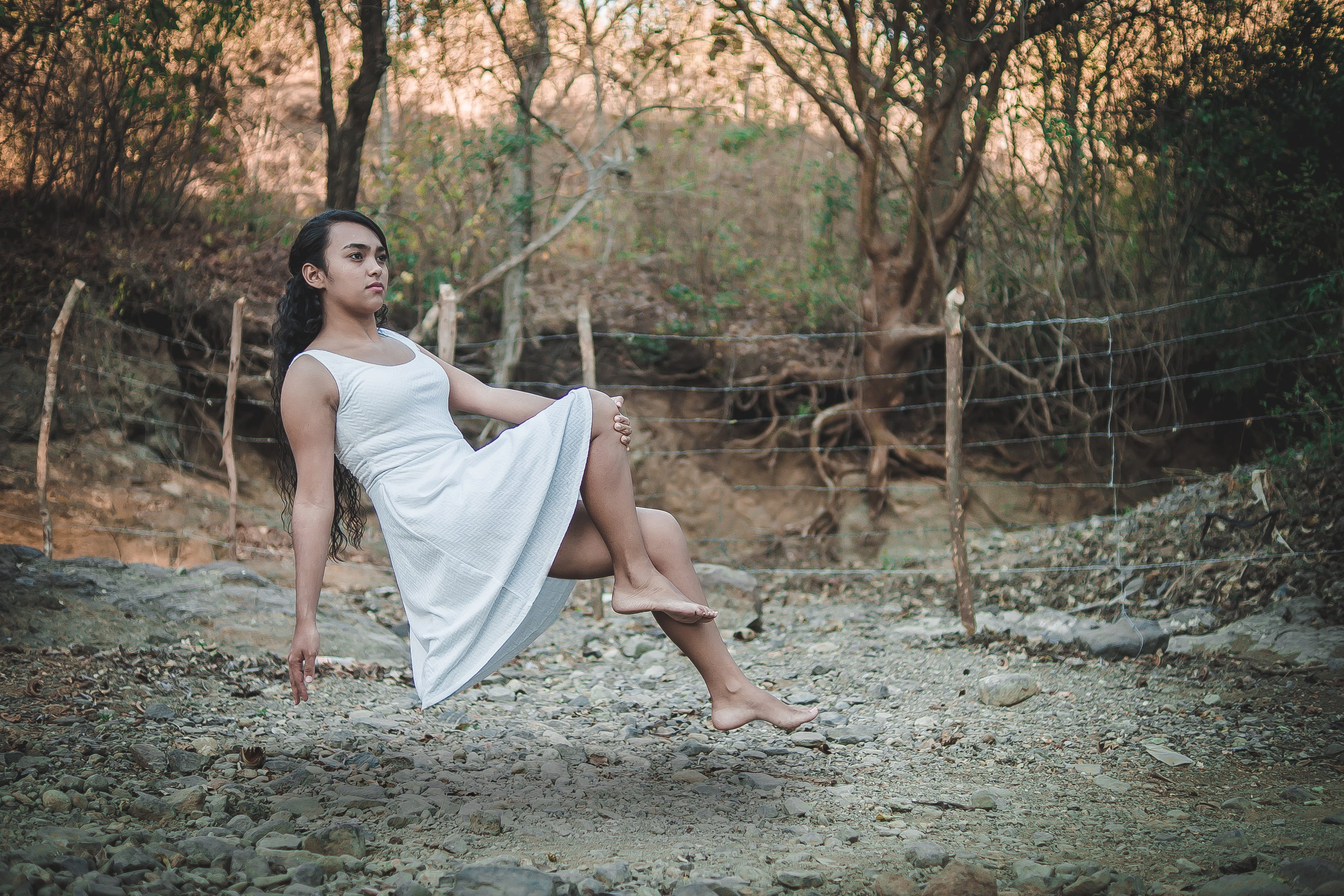 land, hairstyle, tranquility, vintage, sitting, full length, levitation, girl, 4K, hair, air, tree, posing, forest, one person, young adult, barefoot, HD Wallpaper