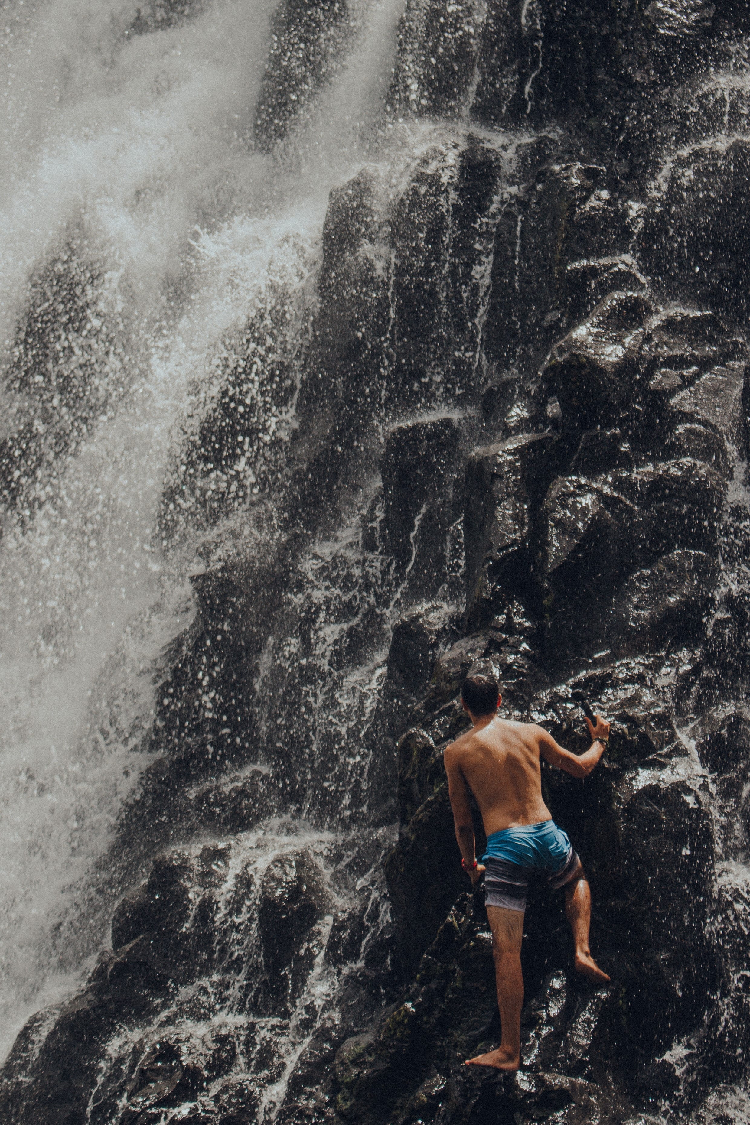 one person, outdoors, federated states of micronesia, sea, rear view, rock - object, solid, waterfall, water, kepirohi waterfall, splashing, rock, day, Phone HD Wallpaper