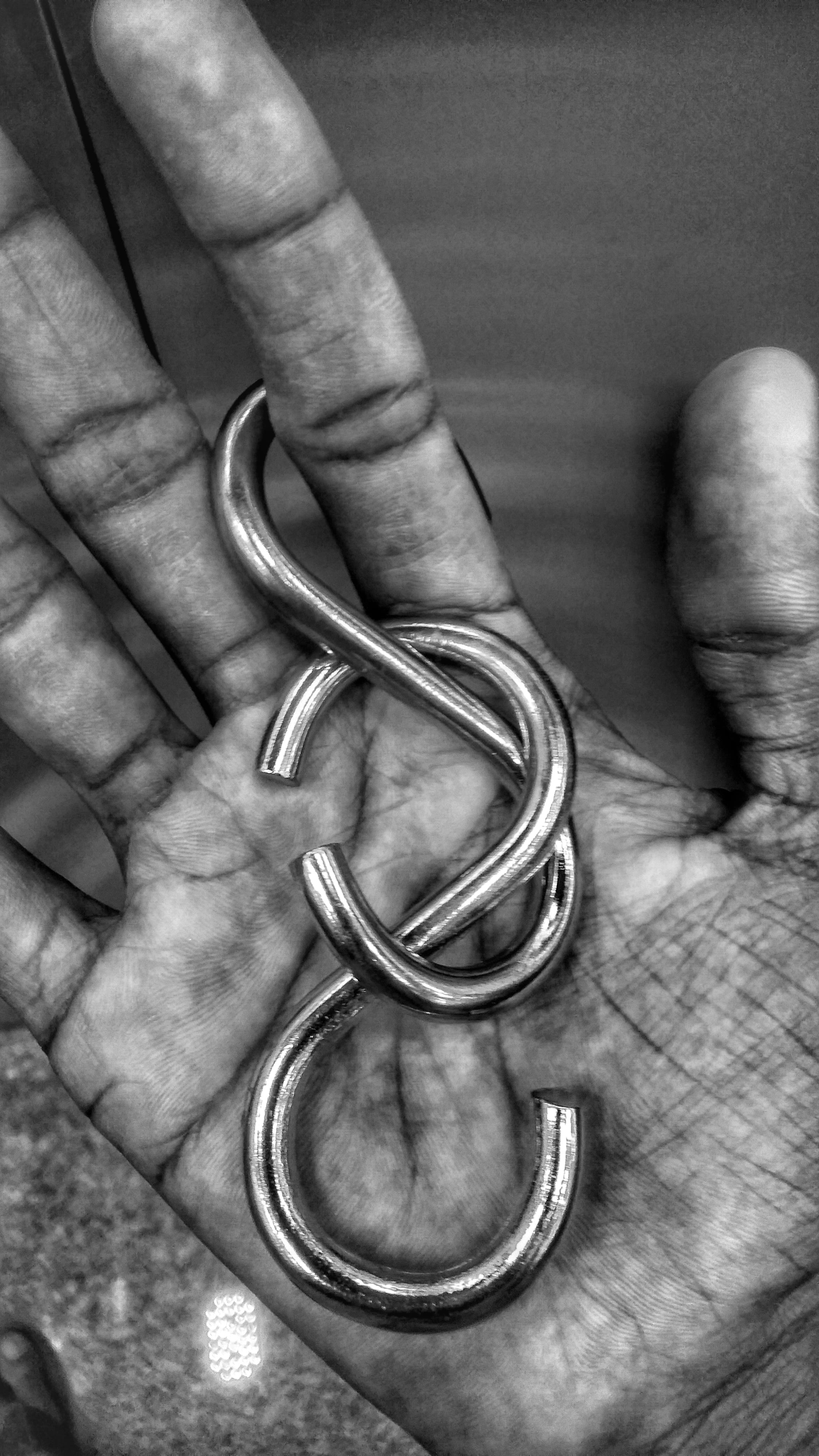 silver, ring, human finger, clothing, holding, coat, apparel, tuxedo, jewelry, close-up, finger, real people, suit, metal, 4K, horseshoe, person, human hand, Phone HD Wallpaper