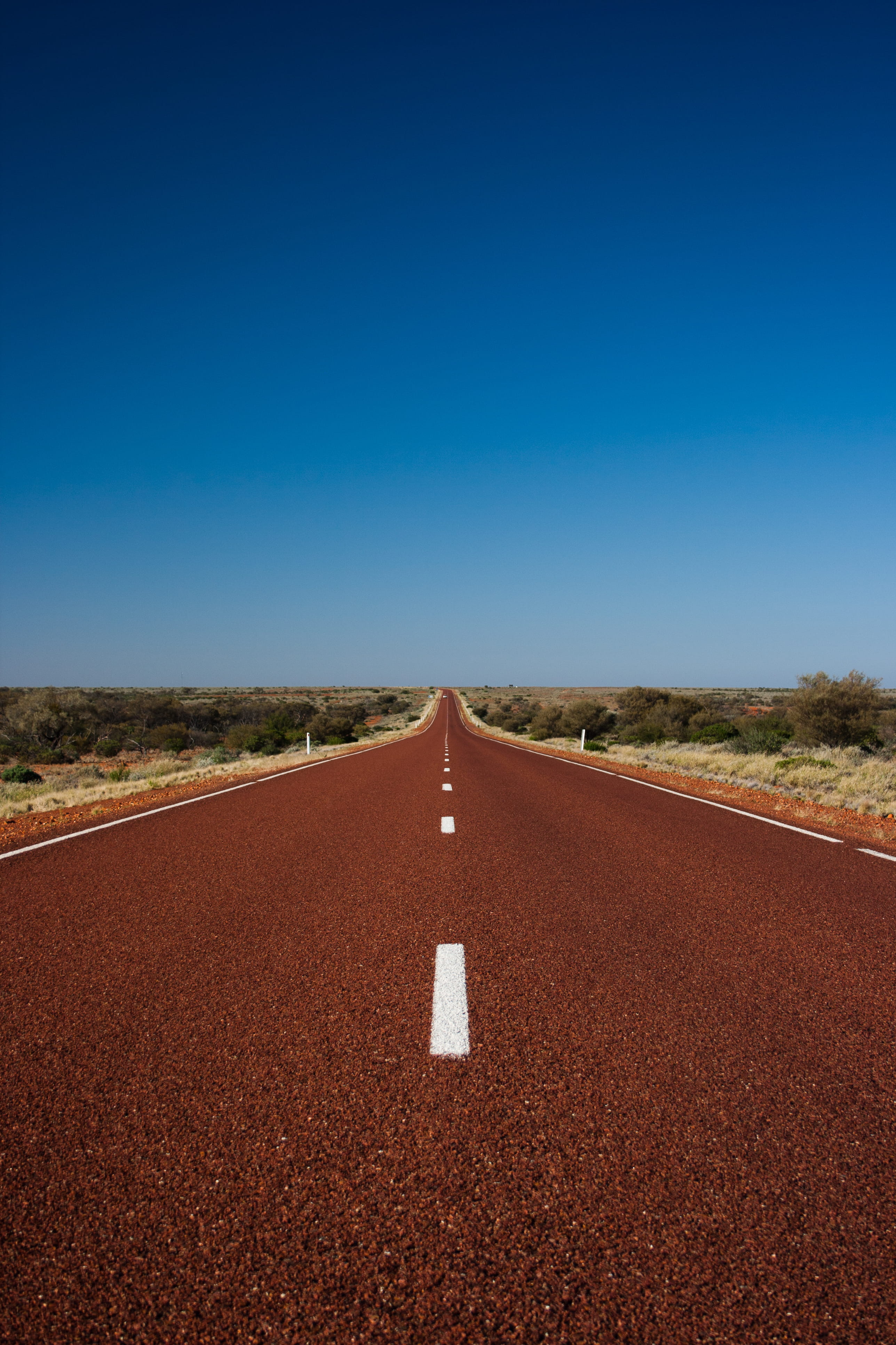 symbol, the way forward, tranquility, marking, land, direction, transportation, empty, clear sky, 4K, australia, day, sign, landscape, outback, blue, road marking, Phone HD Wallpaper