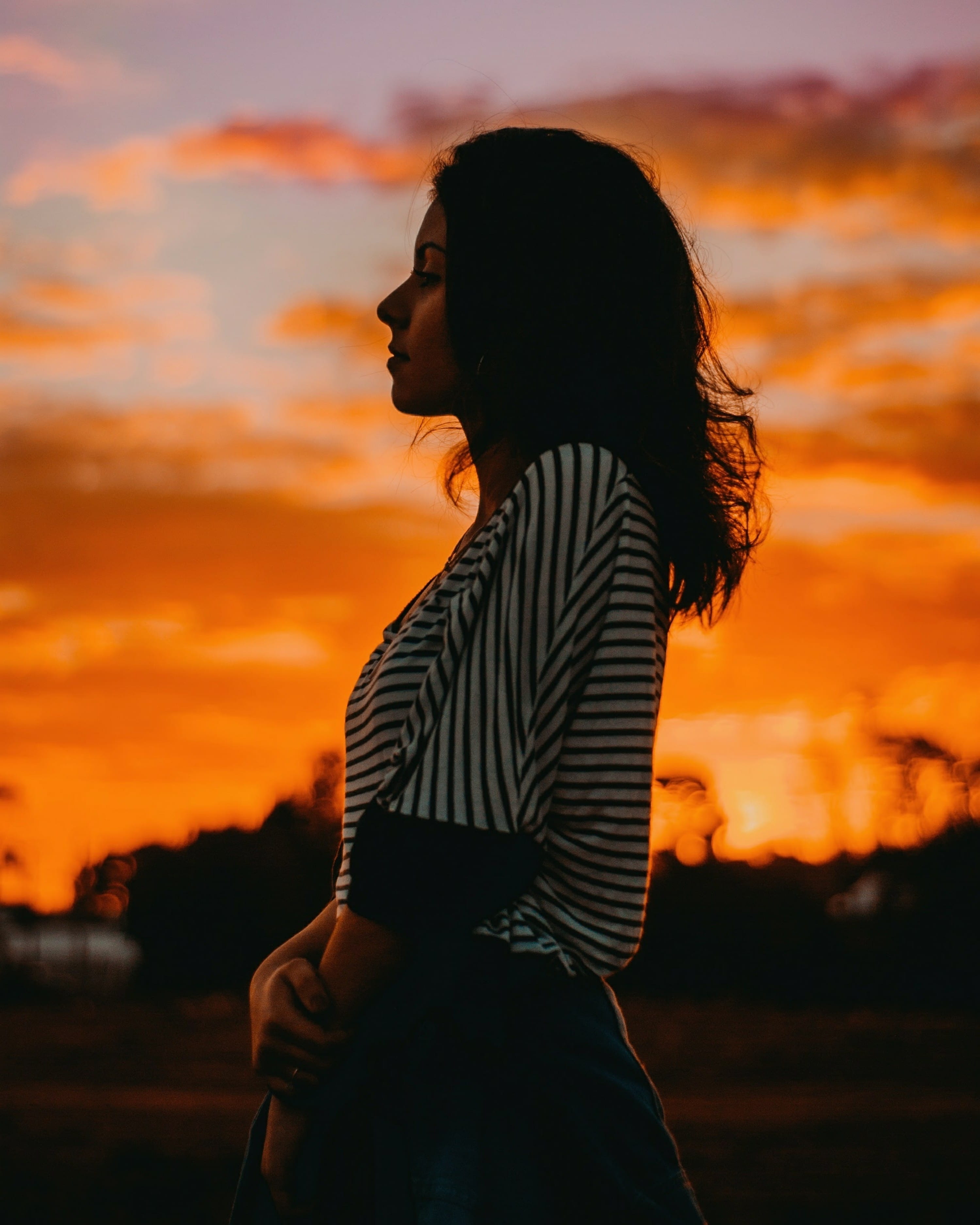 wearing, cloud - sky, one person, sunet, blouse, young adult, contemplation, 2K, sunset, orange color, profile view, hairstyle, sunrise, women, side view, Phone HD Wallpaper