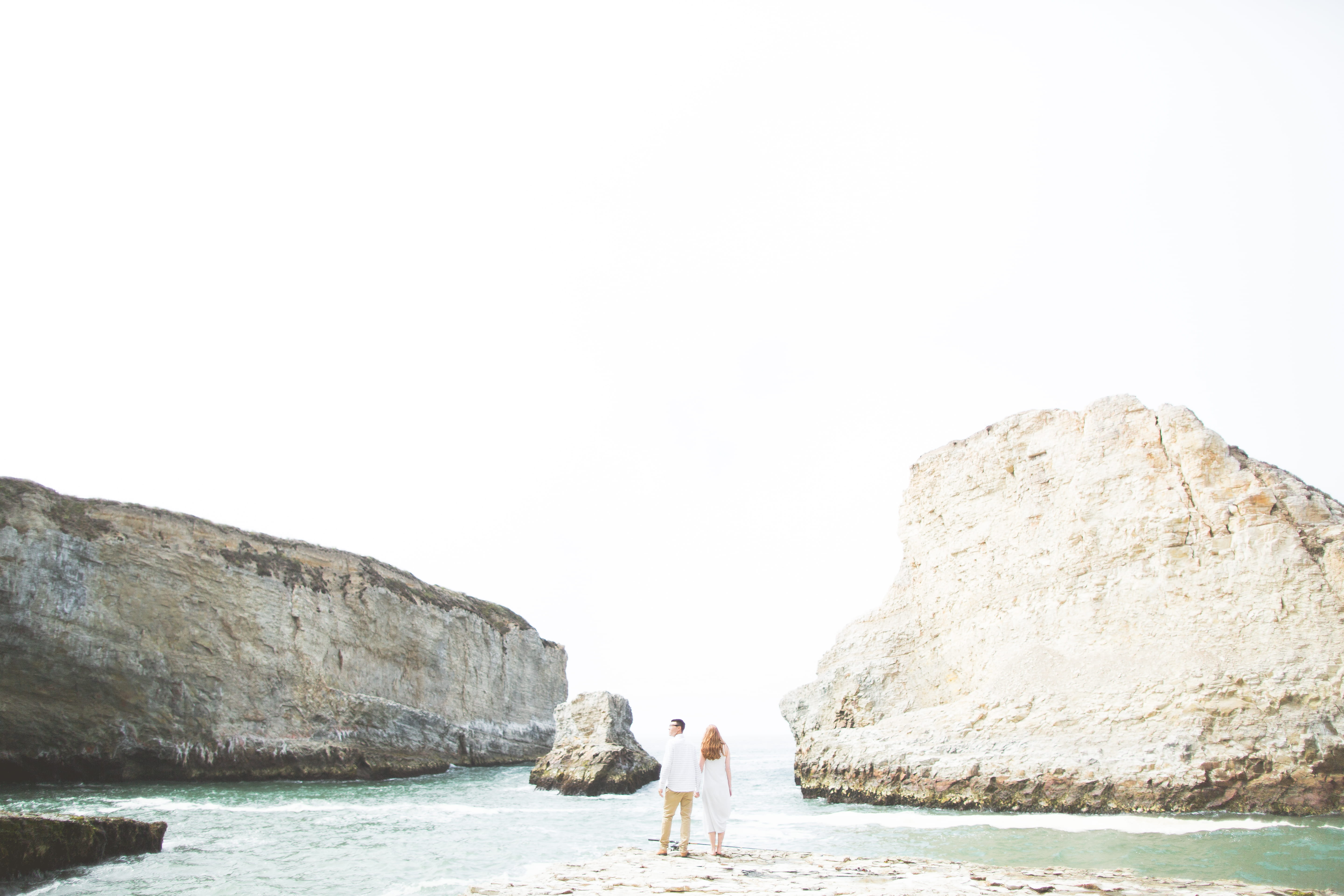 5K, rock, ocean, two people, rock formation, couple - relationship, love, couple, people, davenport, behind, lifestyles, beach, togetherness, real people, HD Wallpaper