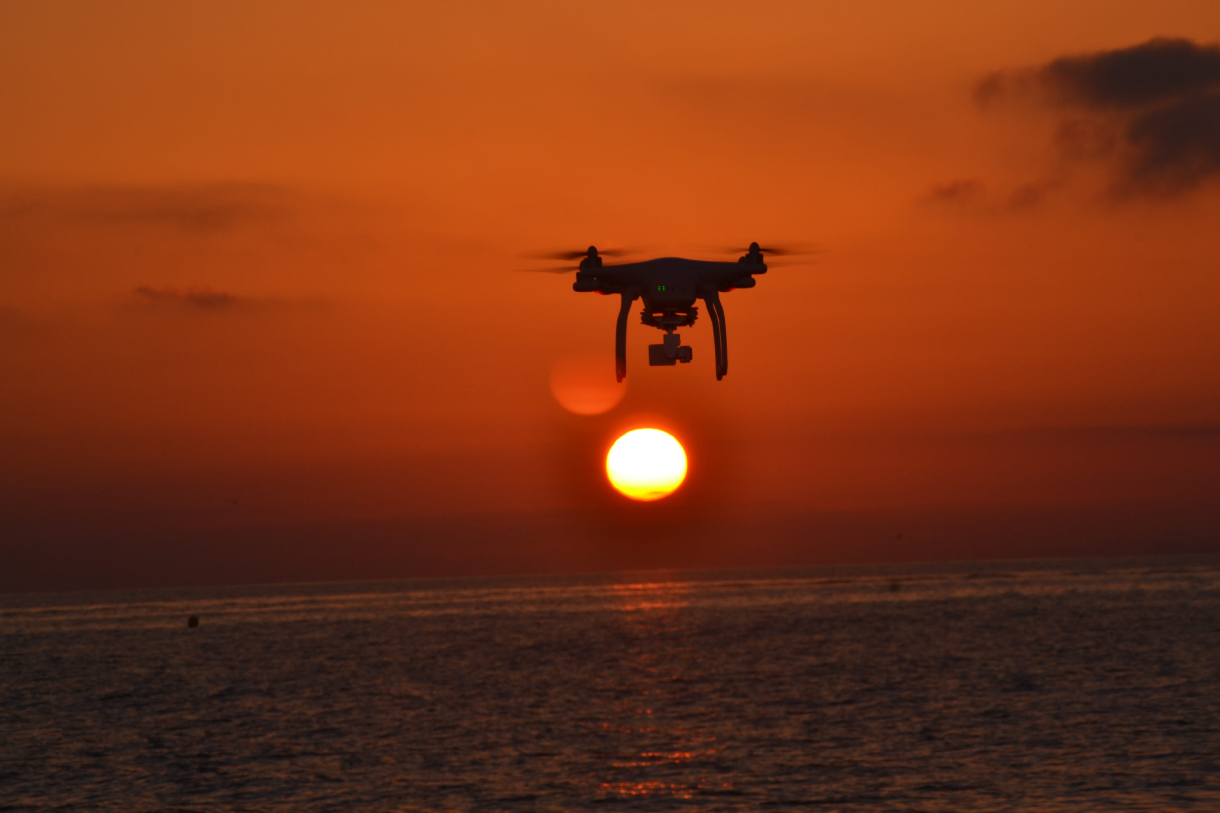 air vehicle, Sun, Drone, no people, transportation, helicopter, camera, aircraft, Sea, scenics - nature, Nature, on the move, water, mid-air, Sunset, Sky, HD Wallpaper