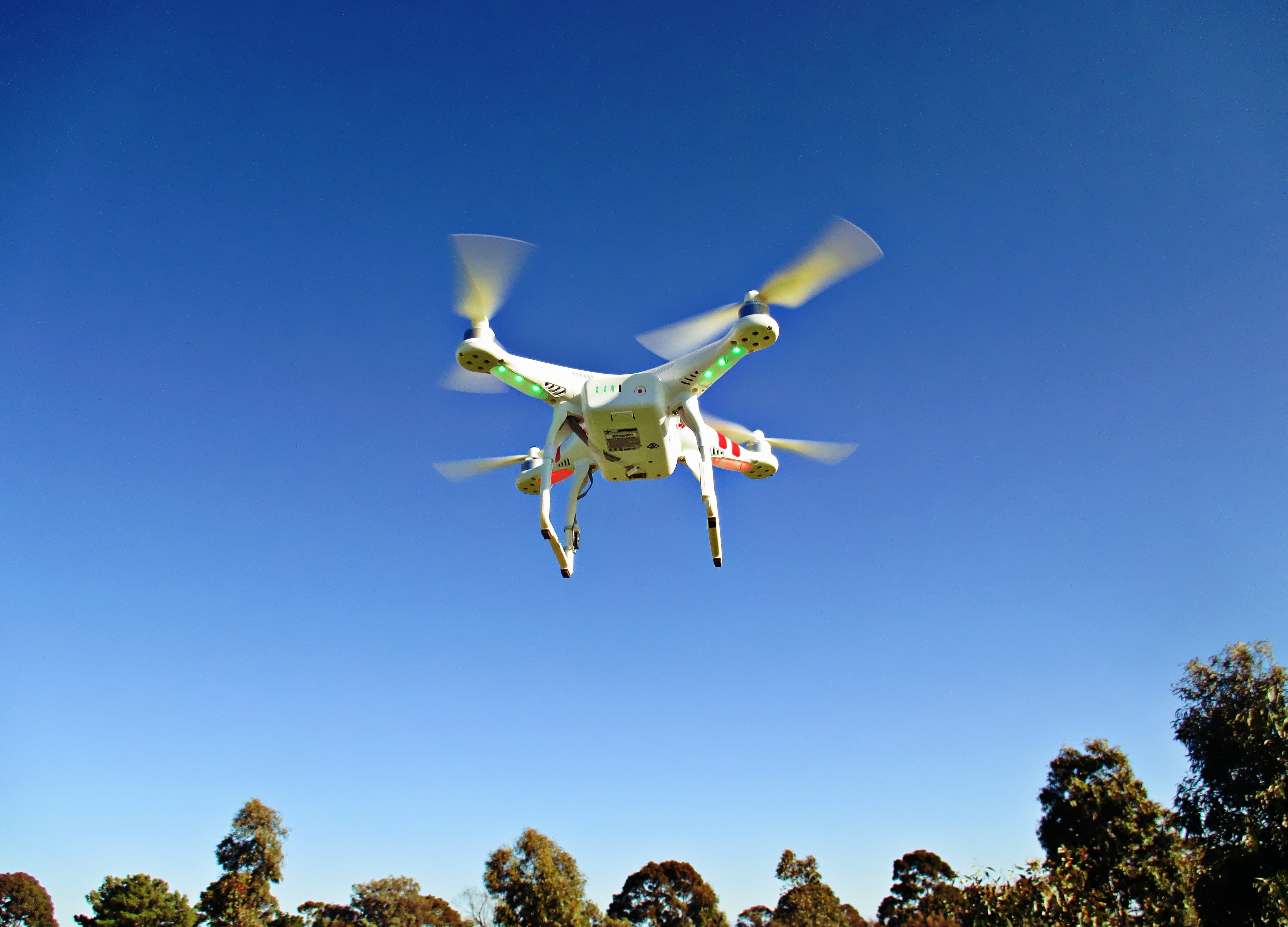 remote, motion, aircraft, aviation, nature, rotorcraft, technology, on the move, blue, quadrotor, aerial, sunny, landing - Touching Down, clear sky, sunlight, HD Wallpaper