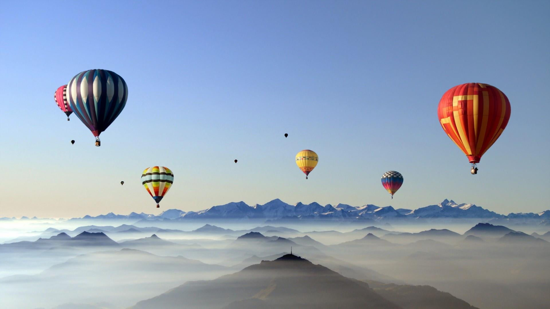 flying, mountain, hills, nature, outdoors, multi colored, mid-air, blue, transportation, sky, mountains, air vehicle, freedom, yellow, mountain range, baloon, HD Wallpaper