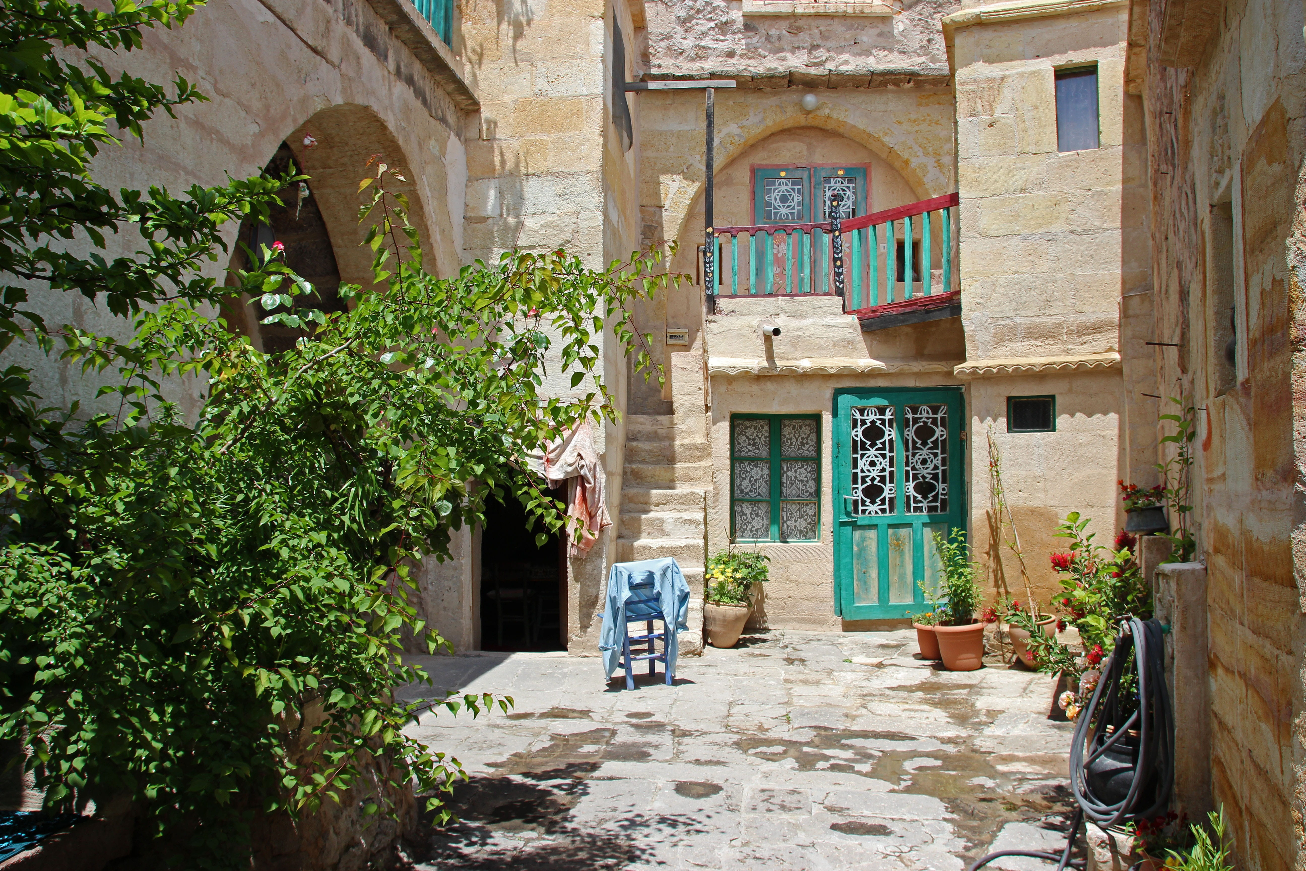 quaint, turkey, arch, flower pots, building exterior, entrance, door, fikus, house, potted plant, sunlight, guest photographer, city, courtyard, day, real people, HD Wallpaper