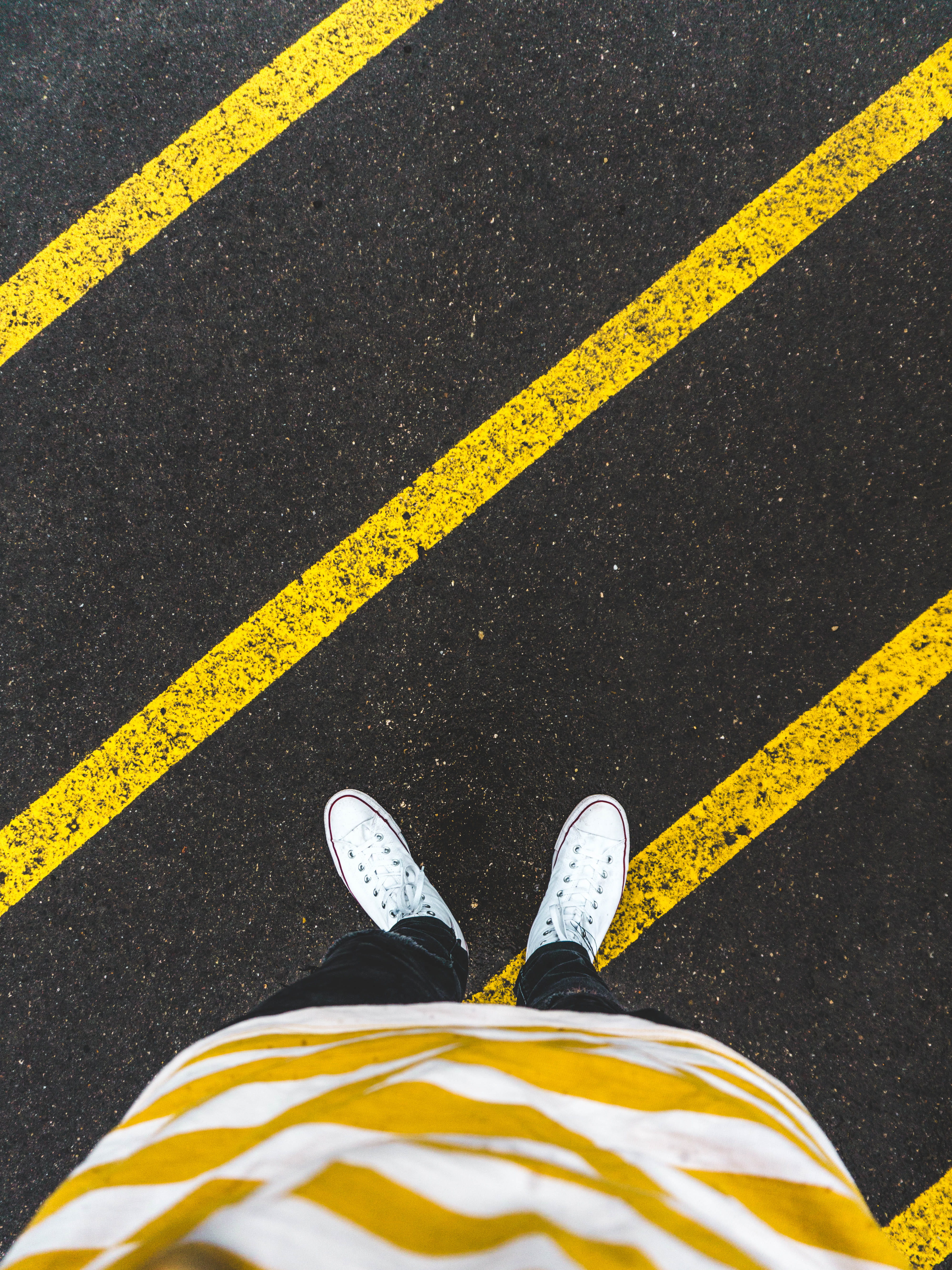 dividing line, low section, body part, yellow, low, one person, day, human limb, converse, person, human body part, fashion, rain, marking, asphalt, sneakers, Phone HD Wallpaper
