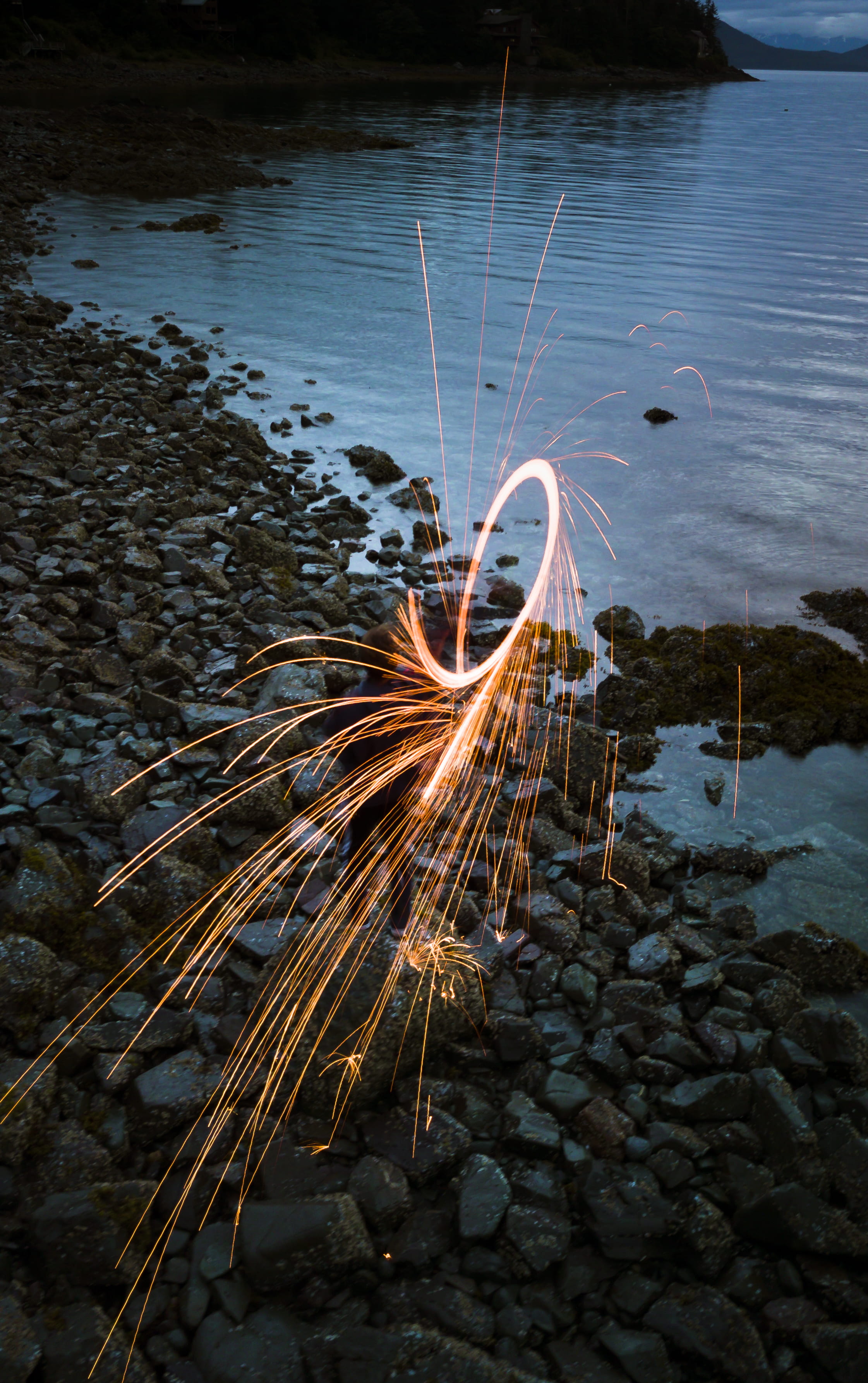 beach, long exposure, sparkle, night, shore, water, no people, reflection, outdoors, high angle view, standing, nature, sparkler, rocks, paint, rocky beach, Phone HD Wallpaper