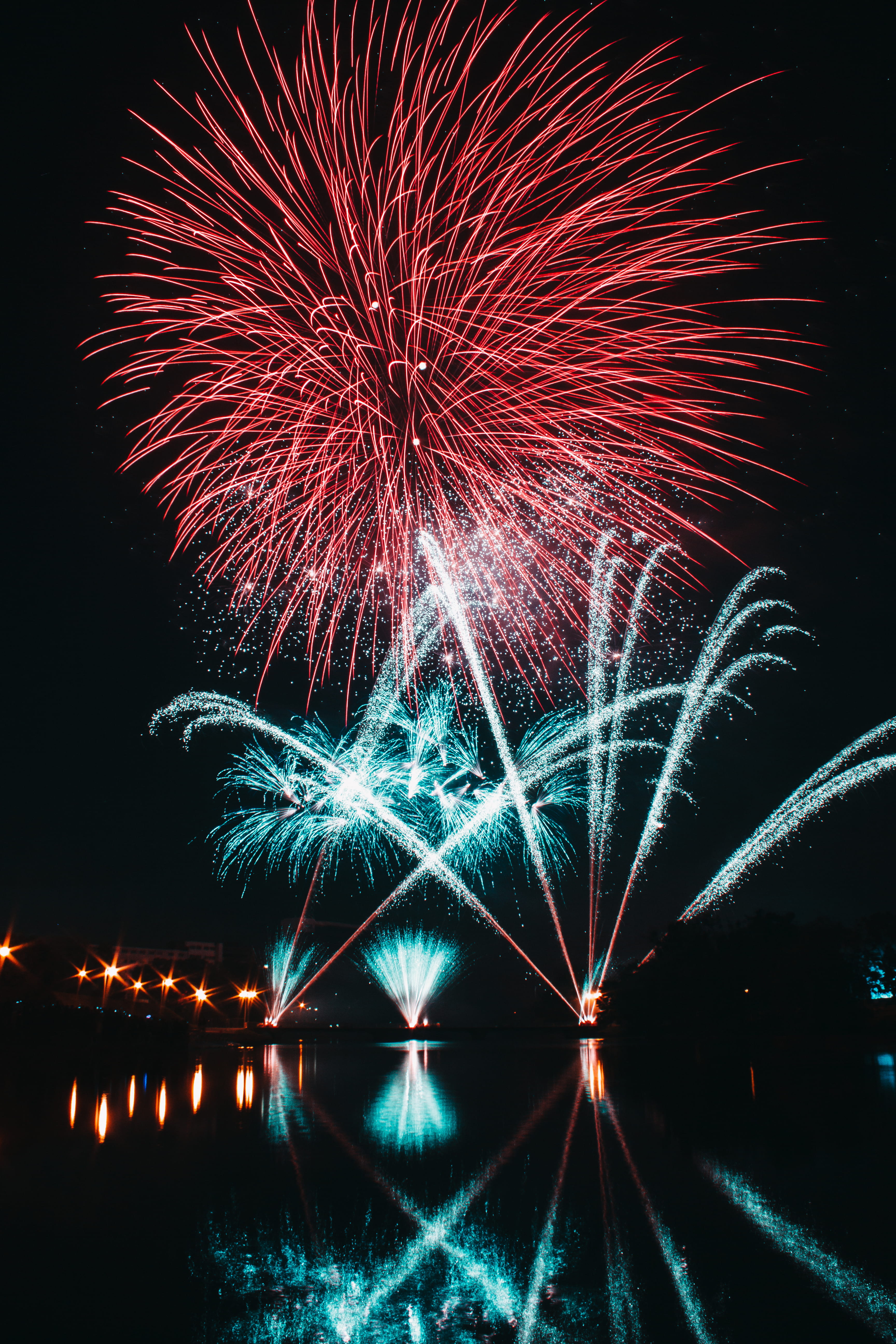 blurred motion, celebration, no people, multi colored, event, illuminated, celebrate, lake, exploding, firework - man made object, lights, nature, outdoors, Phone HD Wallpaper