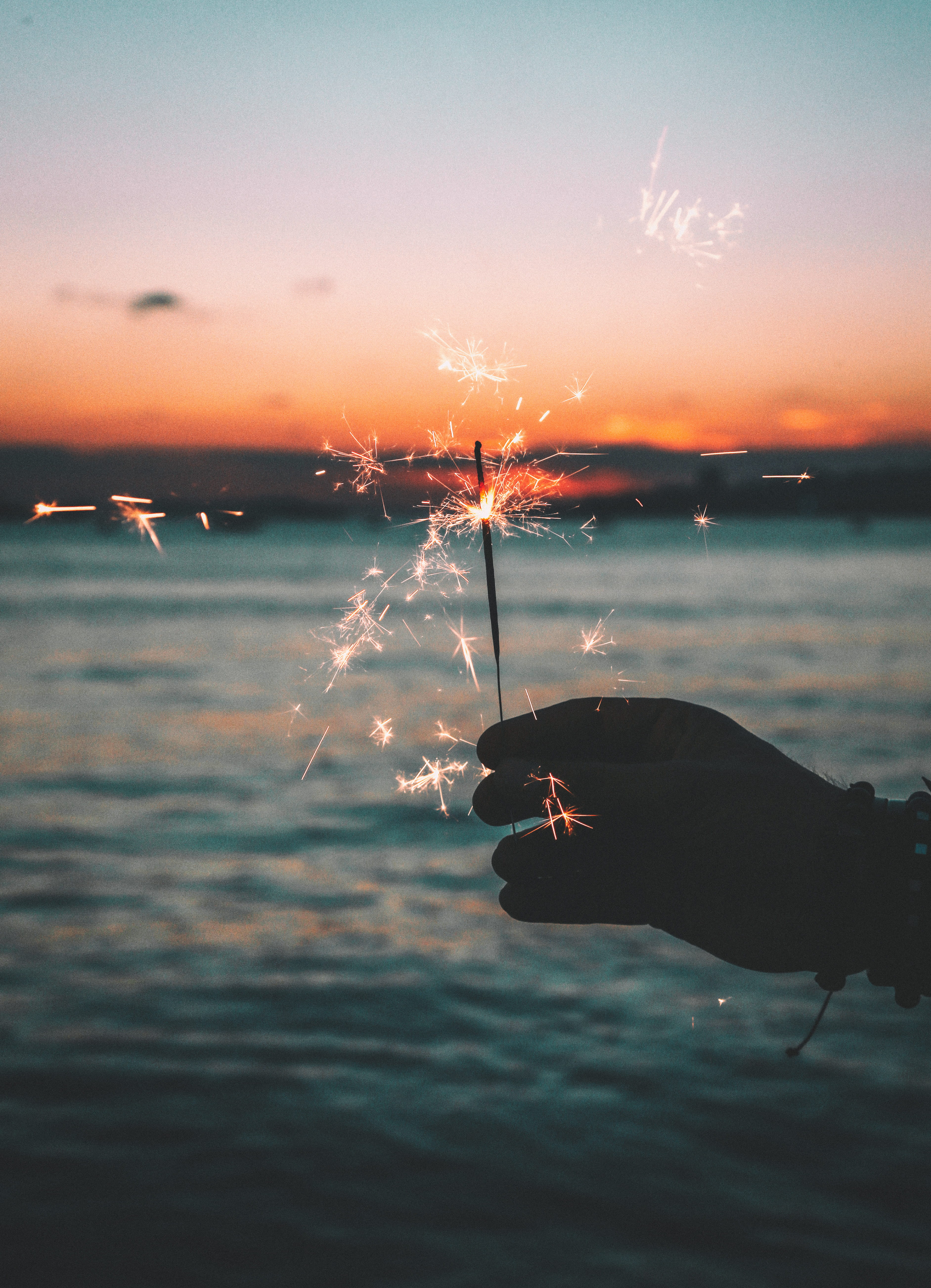 lifestyles, dawn, sunset, dusk, lake, nature, scenics - nature, 5K, sea, human hand, sky, travel, sparks, outdoors, one person, orange color, ocean, landscape, Phone HD Wallpaper