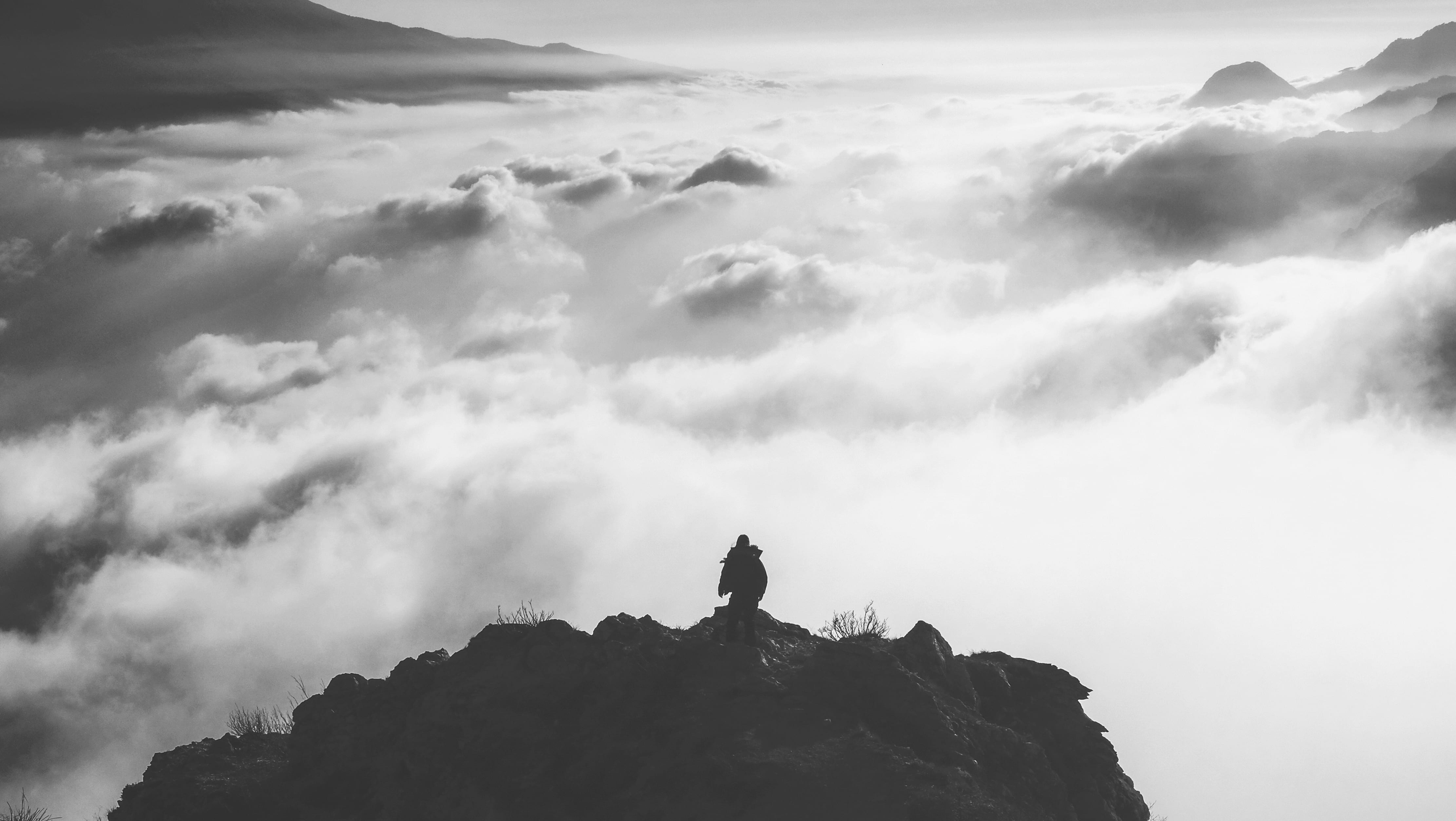 fog, sky, rock, beauty in nature, day, cloud, solid, one person, 4K, outdoors, adventure, mountain range, nature, stnading, silhouette, summit, tranquility, HD Wallpaper