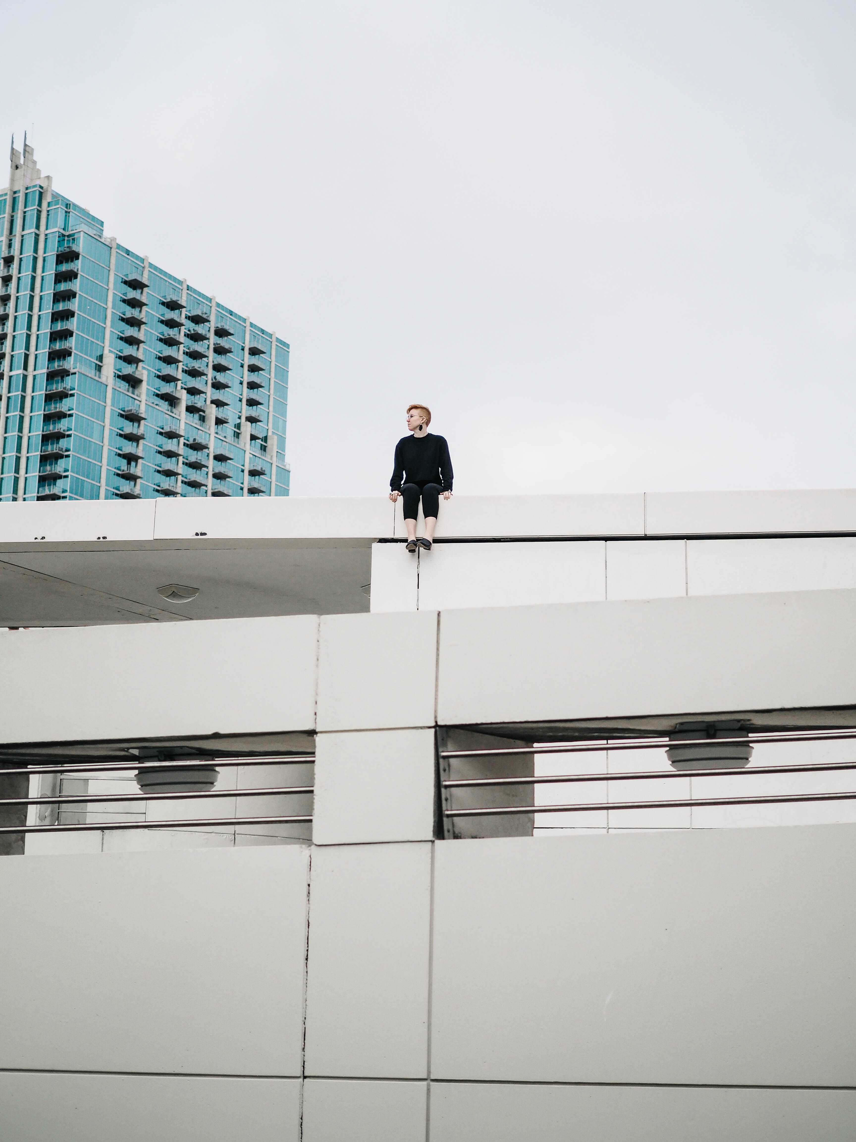 4K, man, sky, modern, skyscraper, sitting, outdoors, real people, edge, full length, worm, men, photography, males, office building exterior, s, roof, Phone HD Wallpaper