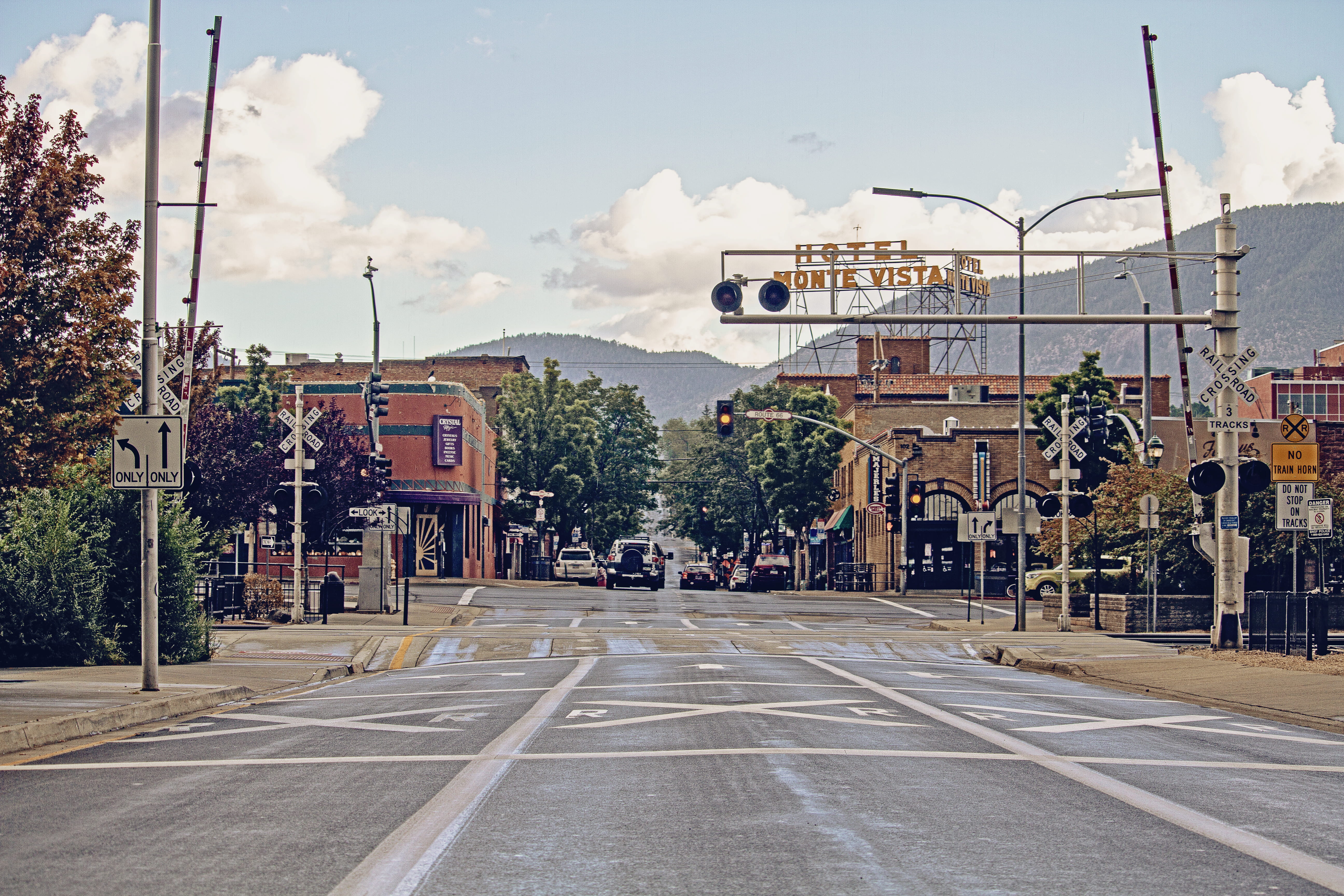 arizona, sign, arrows, outdoors, clouds, train tracks, hipster, the way forward, day, direction, view, flagstaff, road, street, background, diminishing perspective, HD Wallpaper