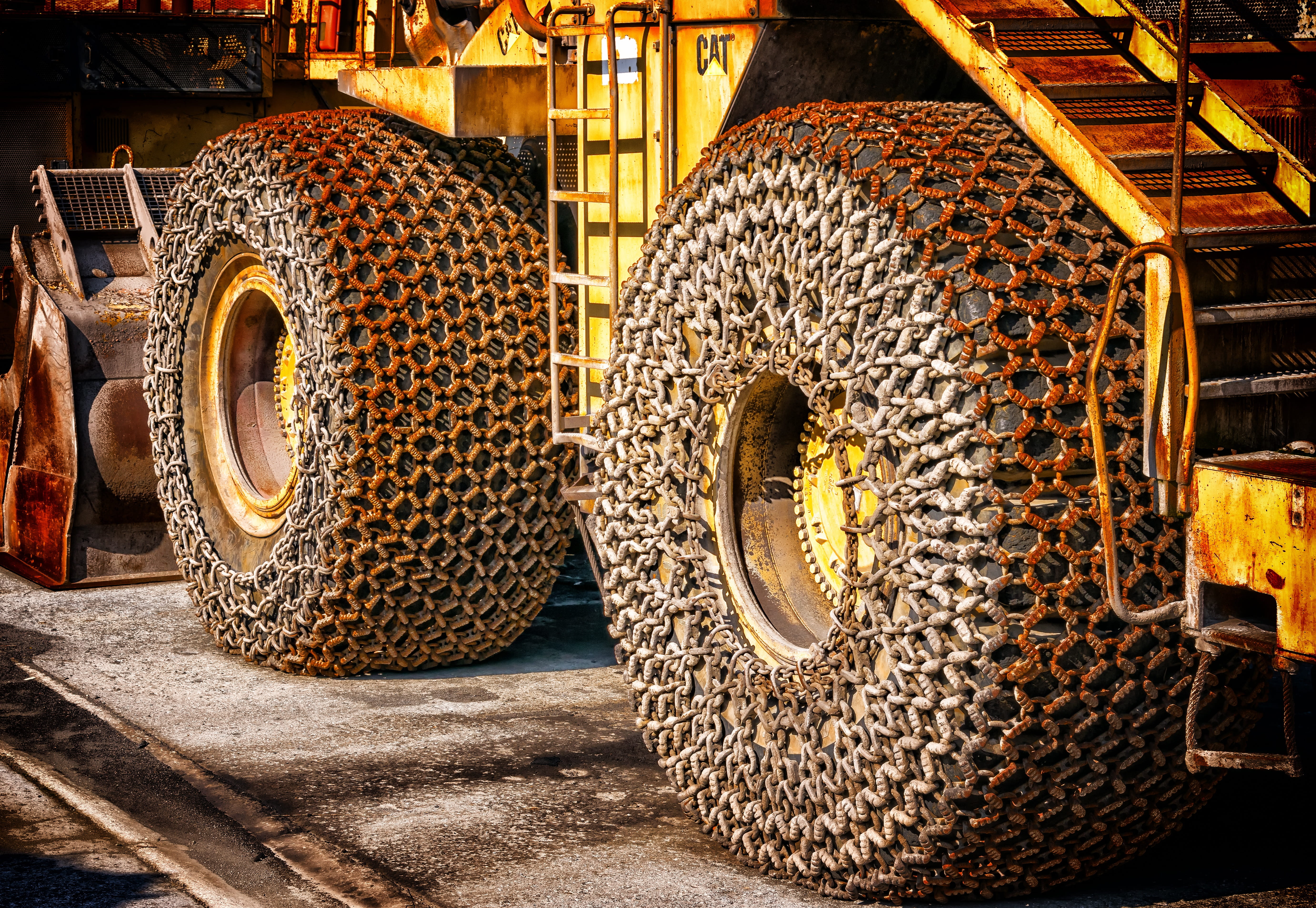 built structure, metal, road, nature, 5K, sunlight, yellow, huge, tire, land vehicle, wheel loader, creativity, factory, tractor, architecture, snow chains, HD Wallpaper