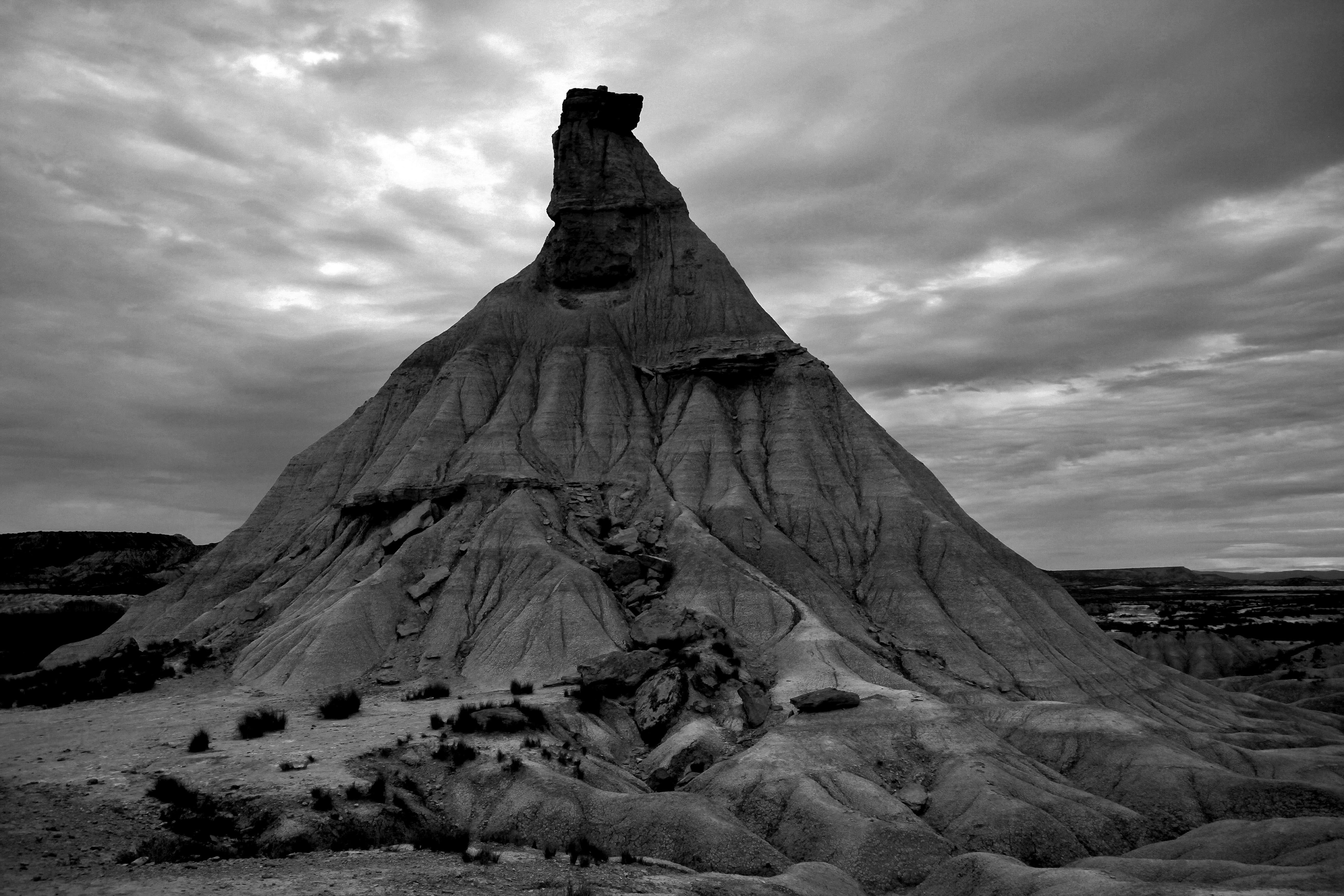 black, white, solid, natural, environment, cloud - sky, desert, sky, clouds, rock, beauty in nature, mountaineering, sunset, architecture, rock formation, HD Wallpaper