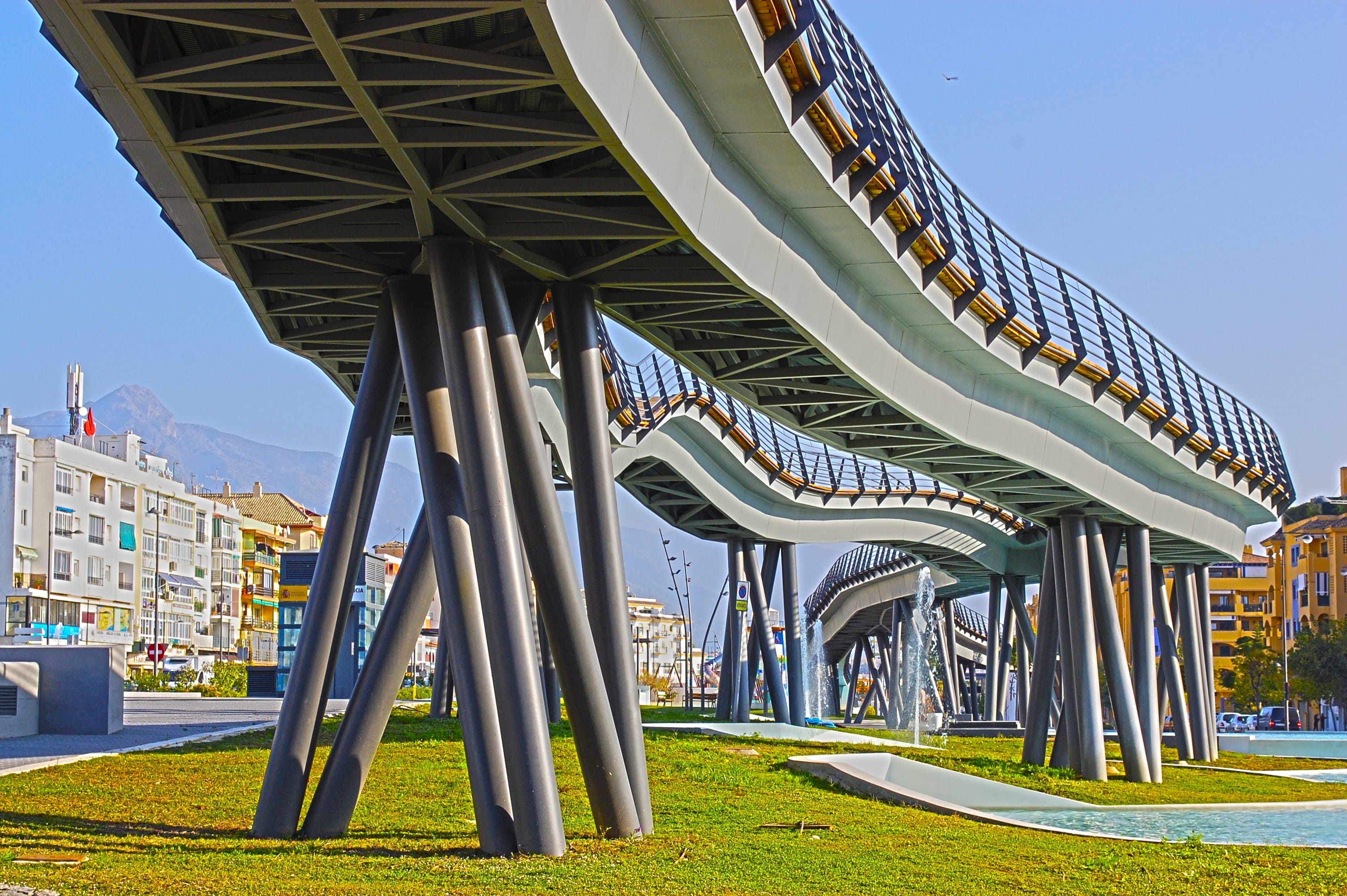architectural column, spain, sunlight, clear sky, architecture, 2K, city, day, water, connection, gateway, San Pedro De Alcantara, green color, bridge, HD Wallpaper