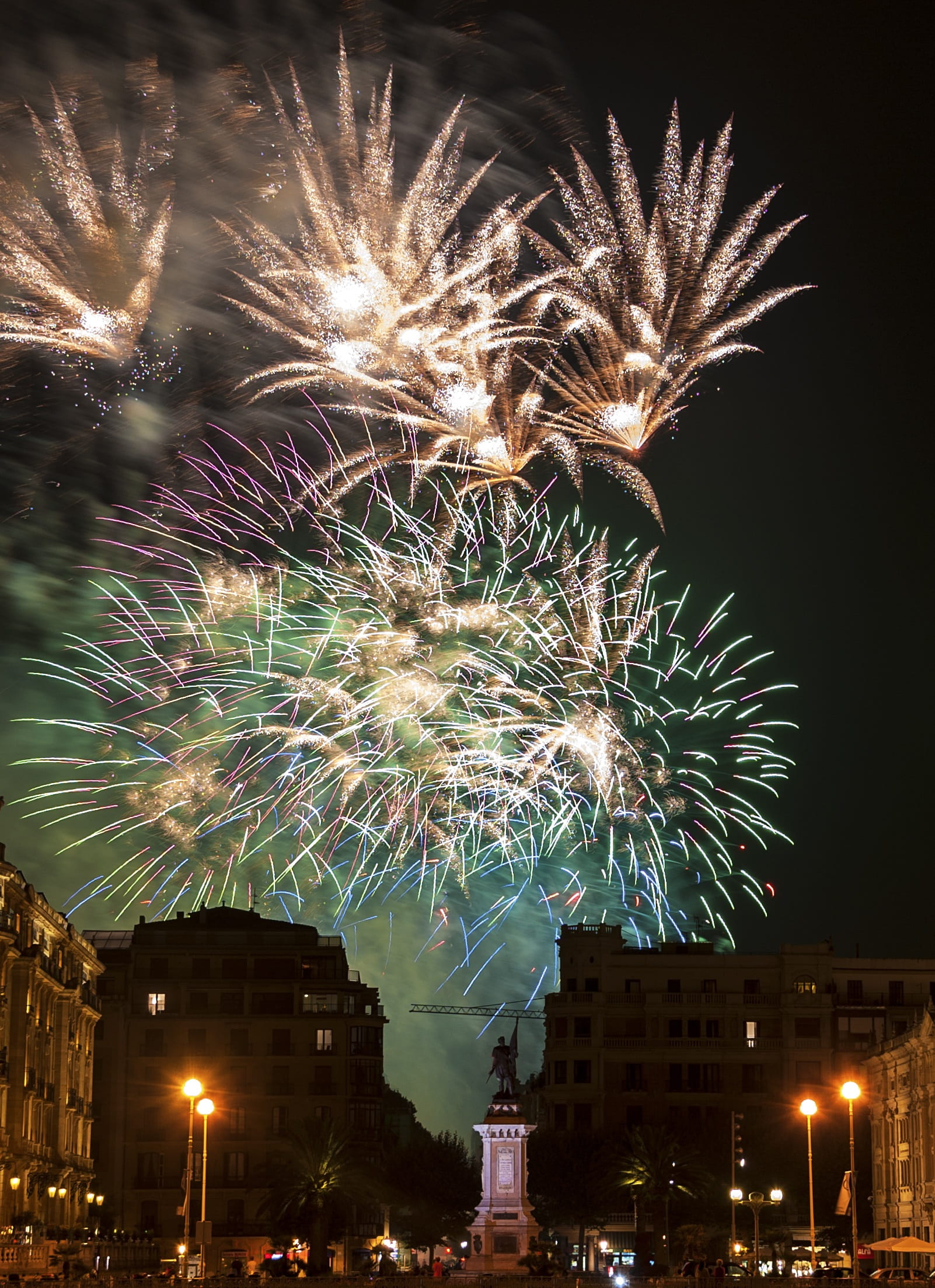 light, low angle view, firework - man made object, sparks, celebration, fires, built structure, glowing, color, no people, sun, outdoors, donostia, long exposure, Phone HD Wallpaper