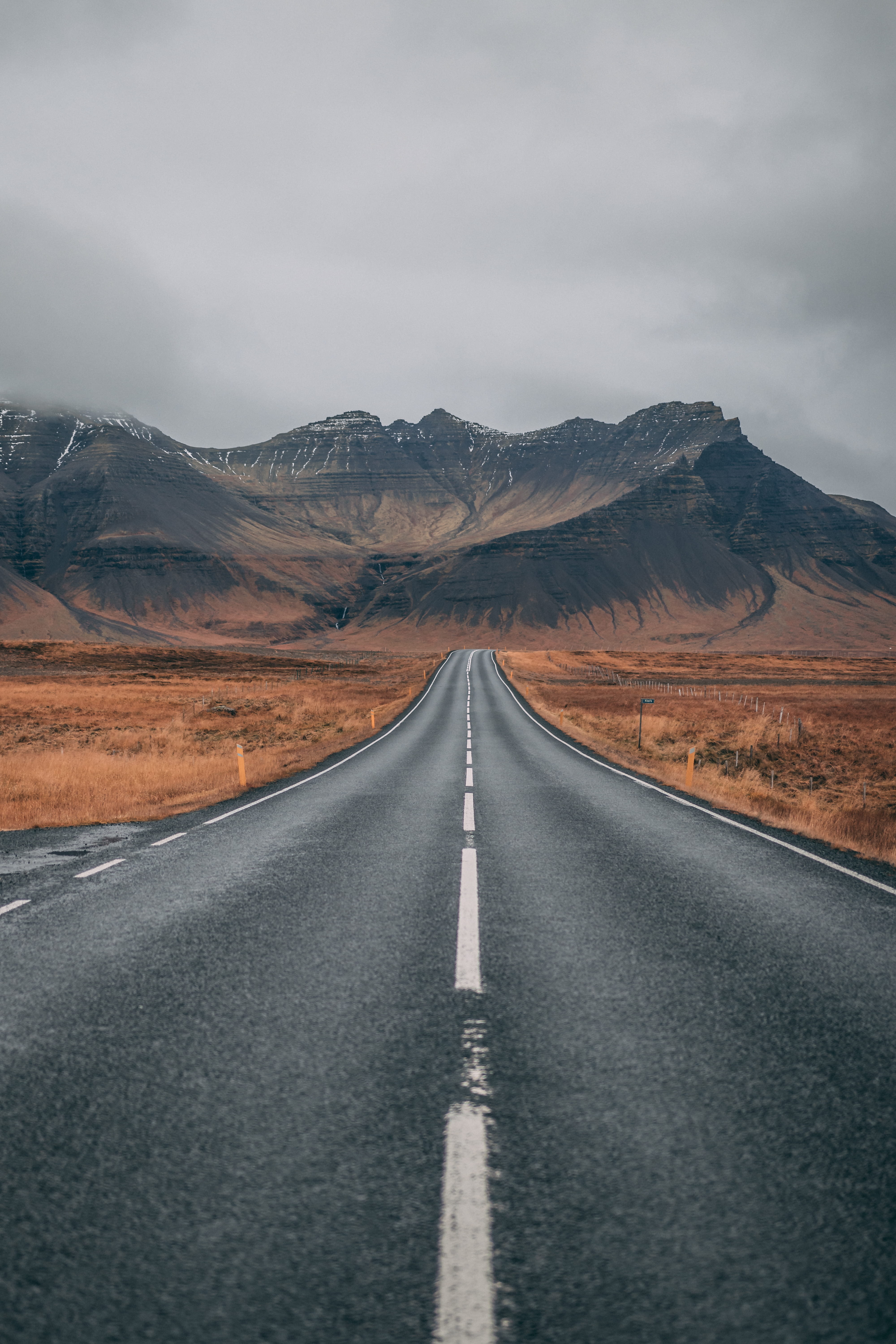 road, landscape, guidance, sky, highway, empty road, marking, outdoors, empty, scenics - nature, mountain range, asphalt, adventure, dark, non-urban scene, Phone HD Wallpaper