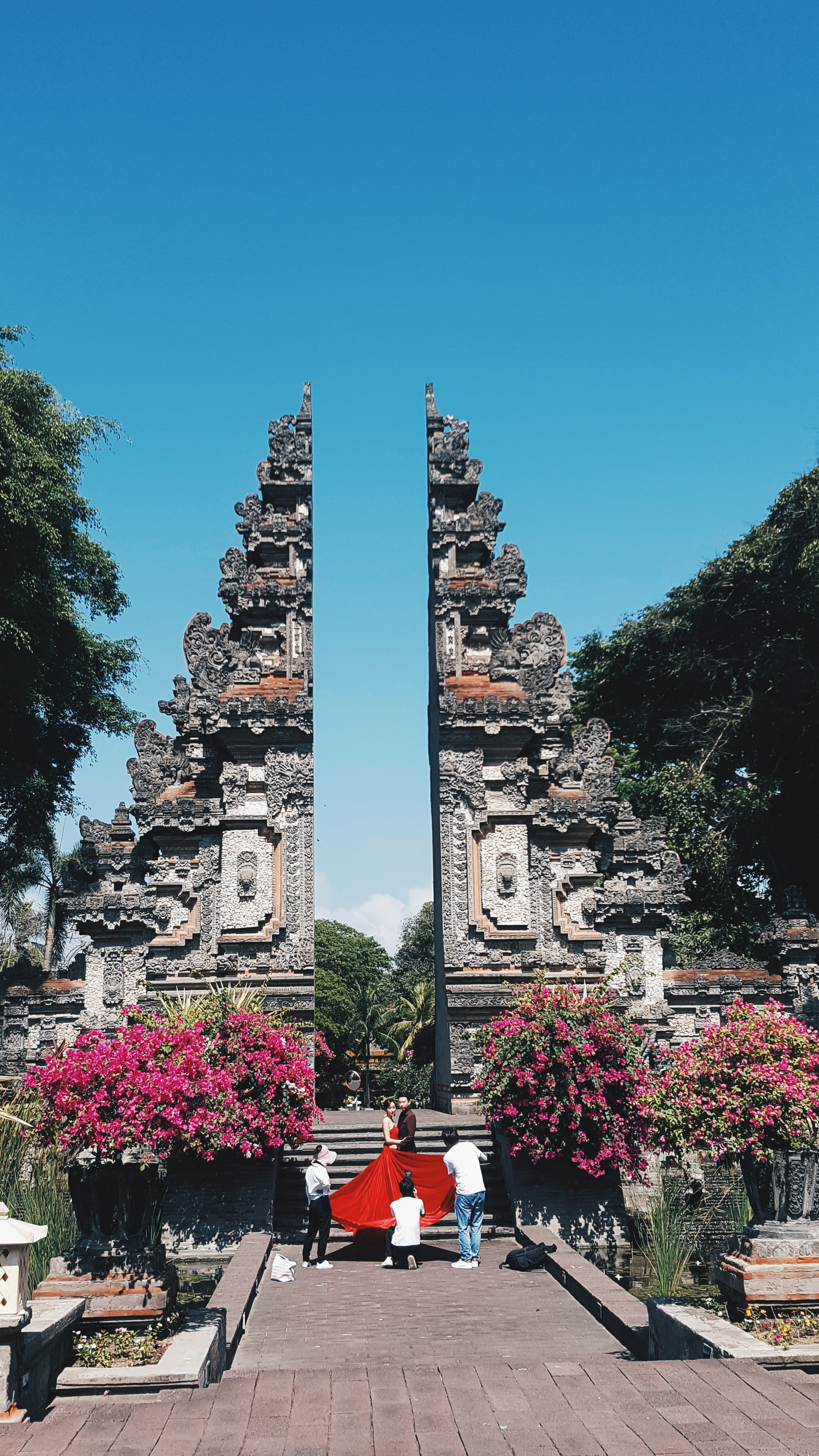 clear sky, garden, belief, nature, kuta selatan, spire, flagstone, unnamed road, outdoors, building, monument, person, religion, history, tower, architecture, Phone HD Wallpaper