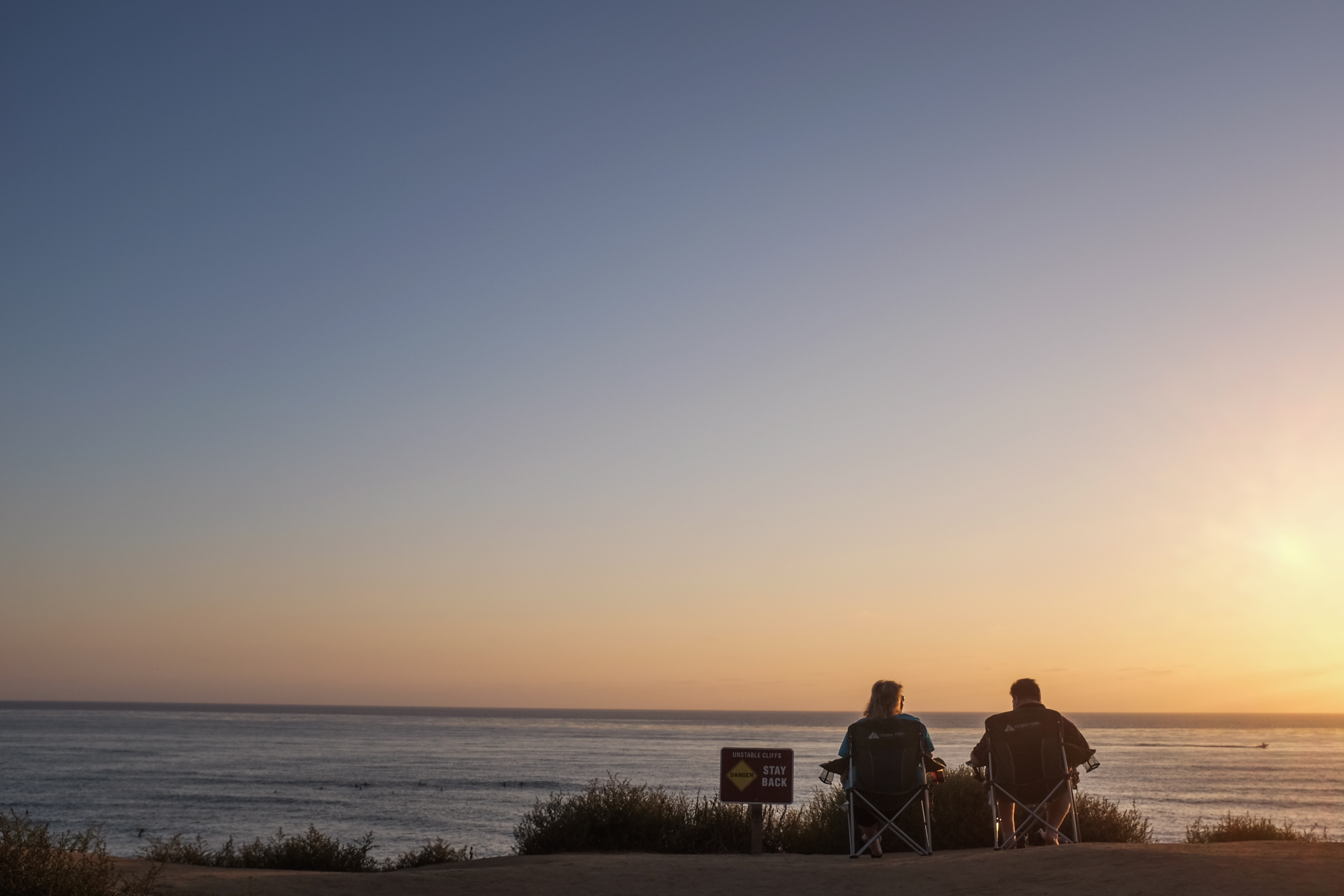 two people, land, camping, positive emotion, sea, chairs, sitting, anniversary, outdoors, adult, beauty in nature, hour, relaxation, facing, real people, HD Wallpaper