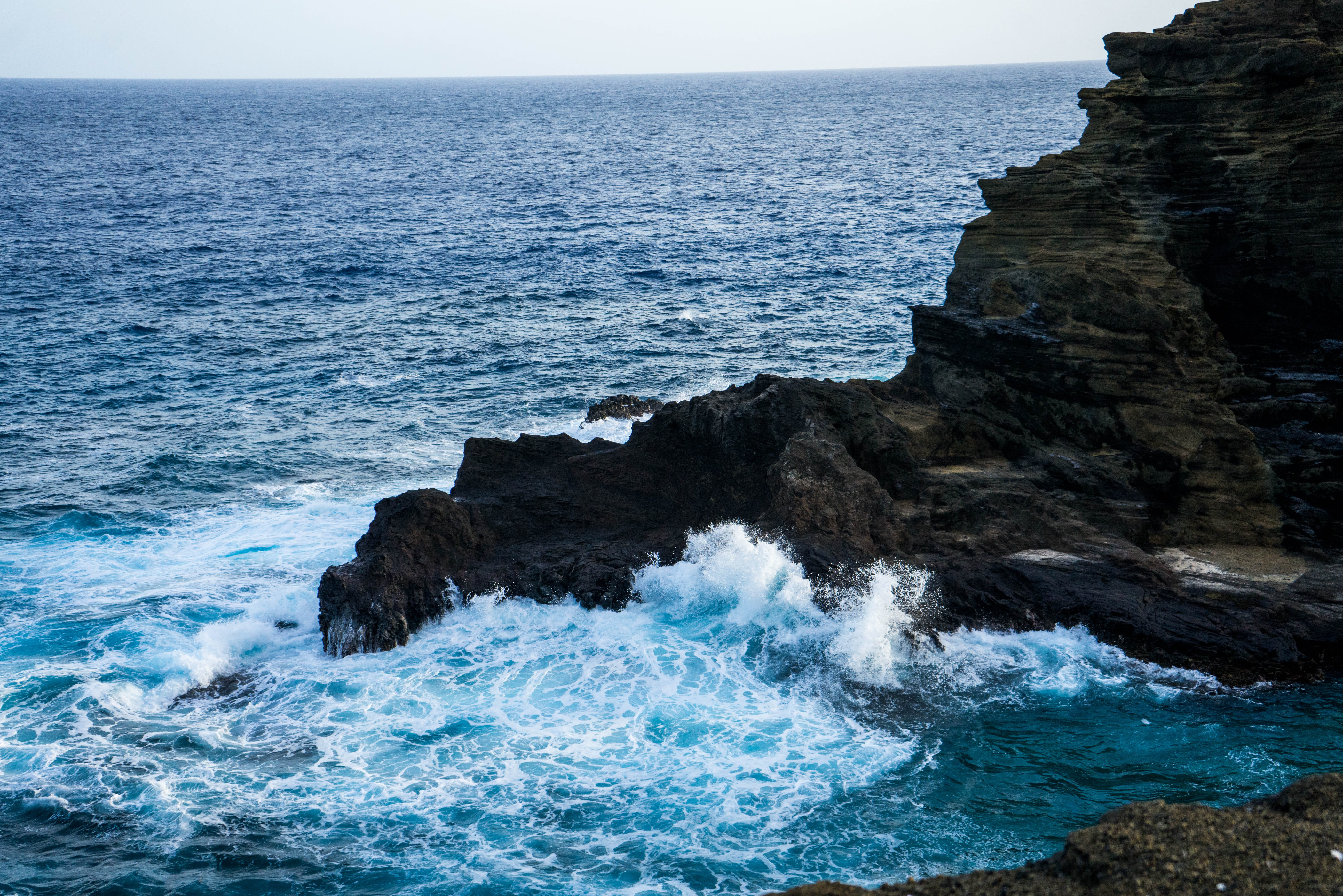 sea, aquatic sport, land, rock formation, North Shore, horizon, rocks, island, hawaii beach, sky, Beach, cliff, blue, rock - object, 5K, power in nature, HD Wallpaper