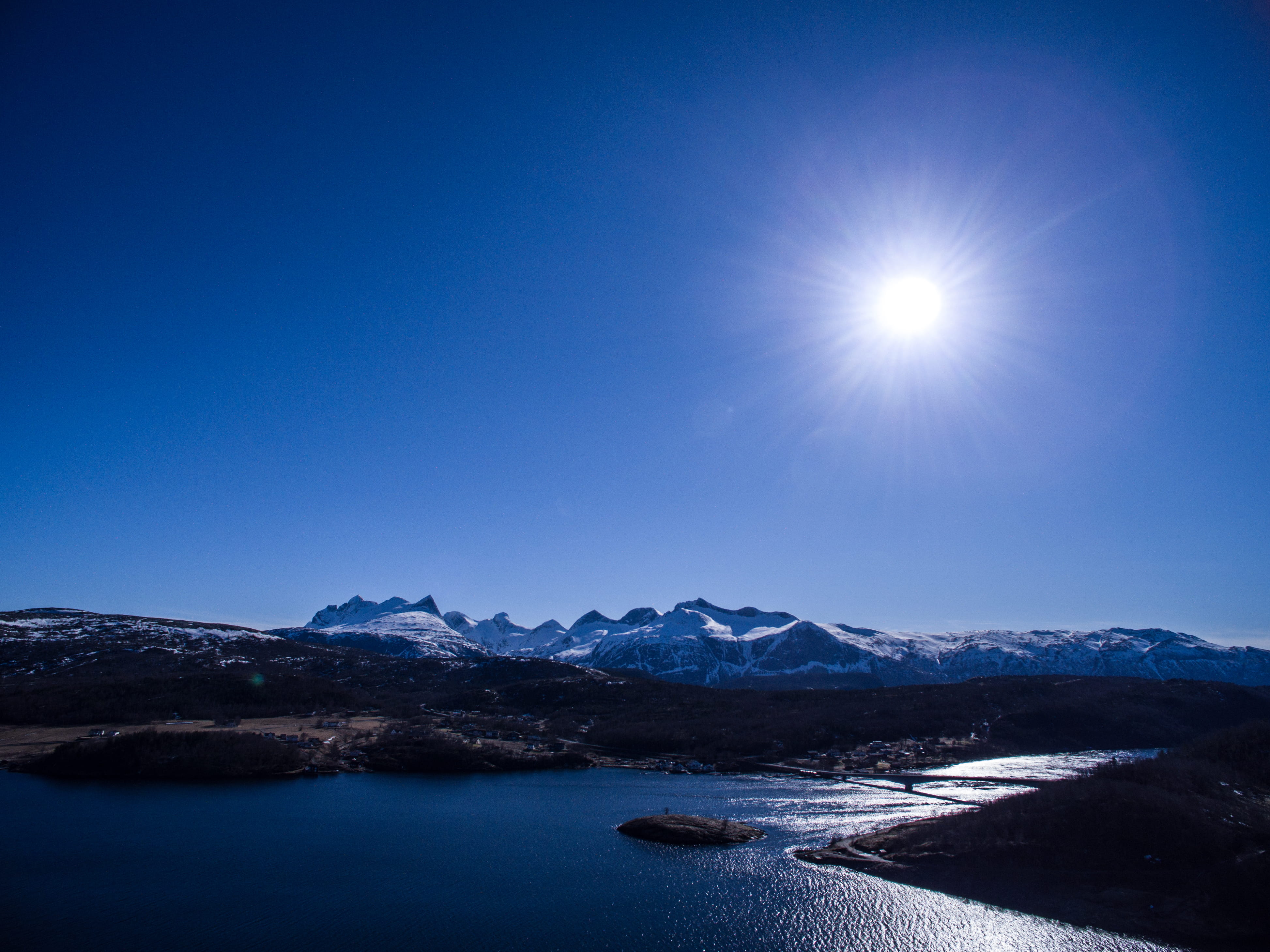 lens flare, sunlight, snowcapped mountain, mountains, nordland, mountain range, beauty in nature, heaven, tranquil scene, bright, sea, bridge, snow, infrastructure, HD Wallpaper