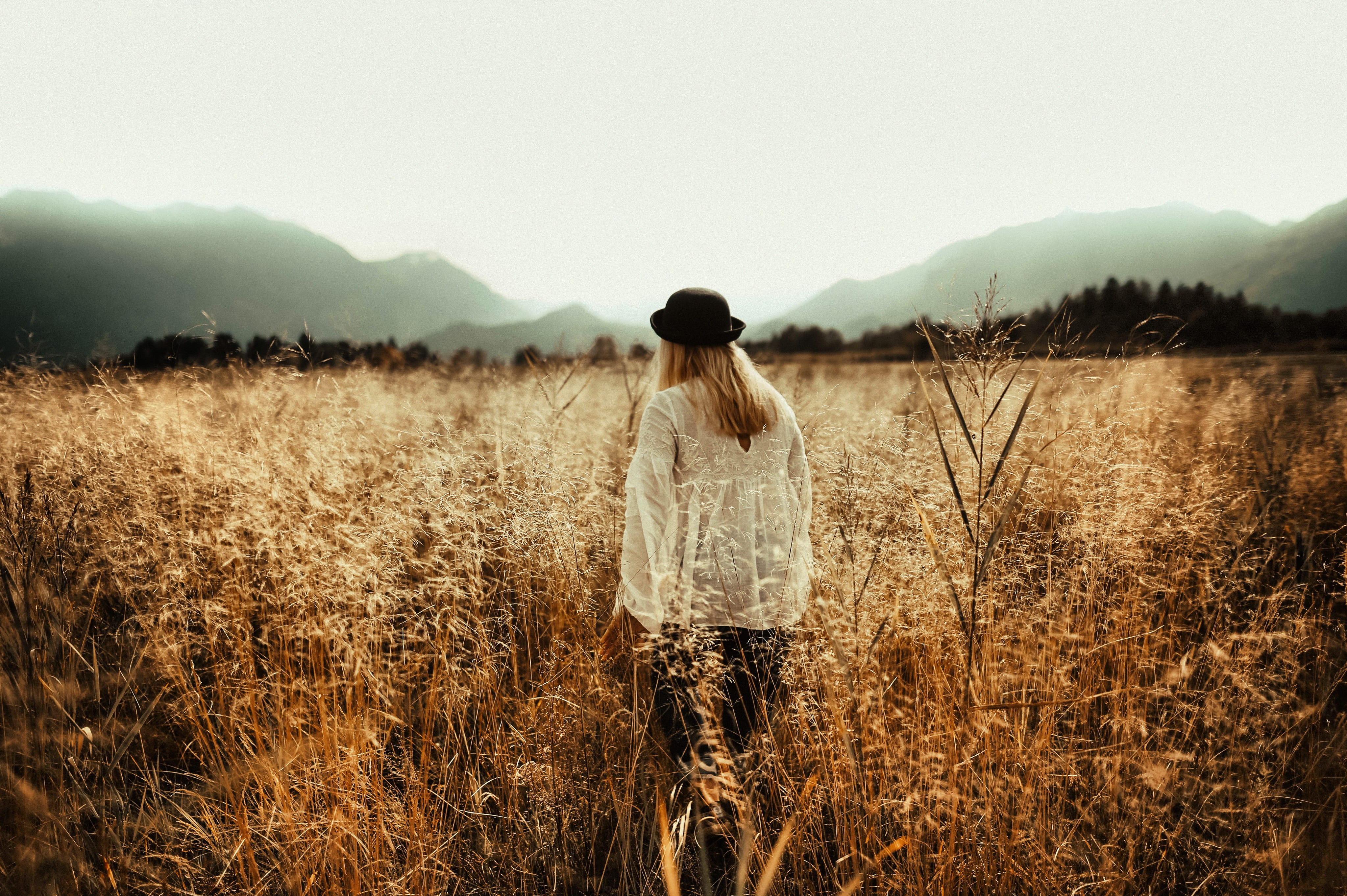 mountain, nature, beautiful, rear view, hazy, outdoors, hairstyle, freedom, countryside, young adult, foggy, gloomy, grass, field, dawn, standing, three quarter length, HD Wallpaper