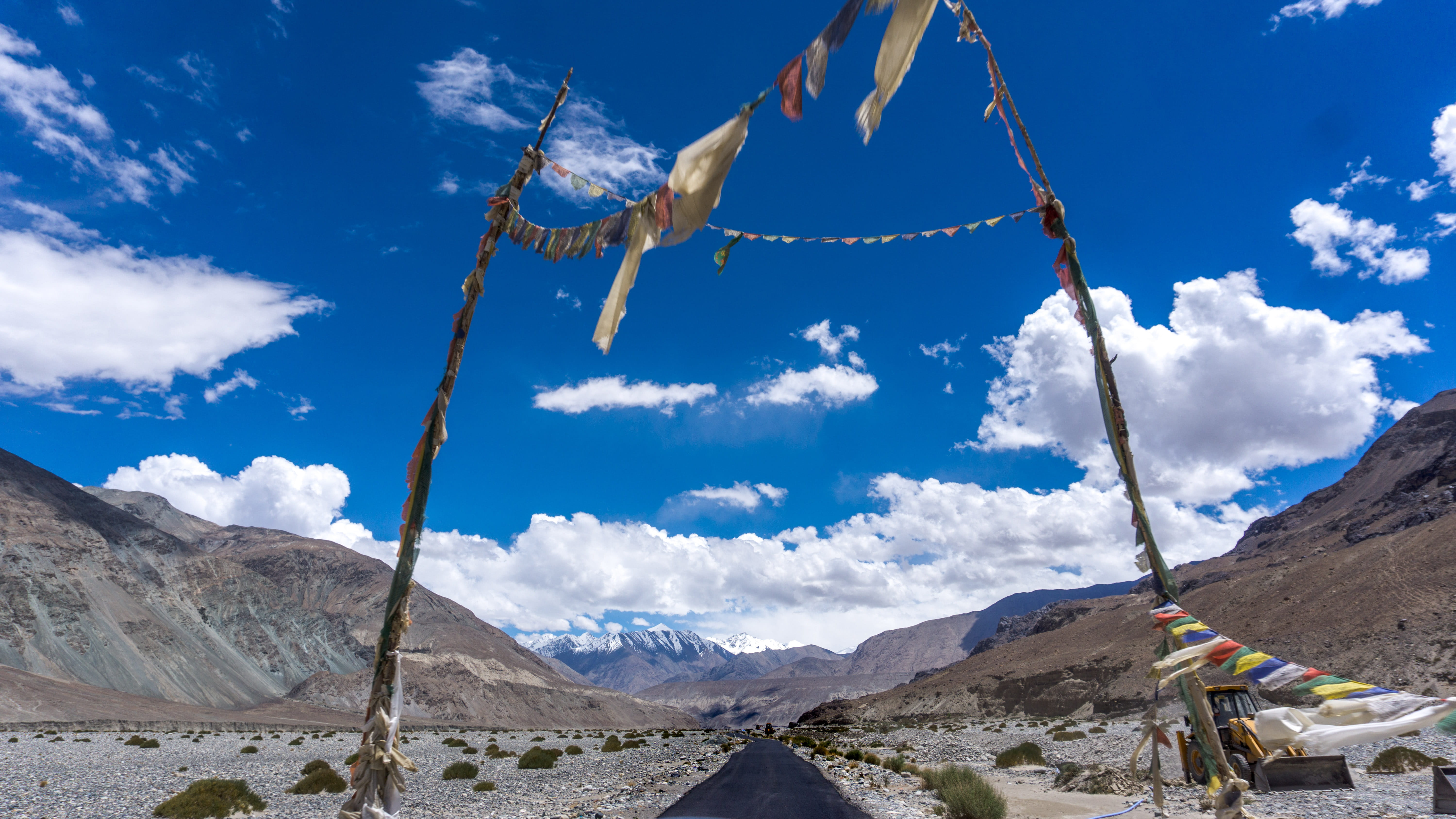 non-urban scene, no people, buddha, sunlight, cloud - sky, environment, tranquil scene, land, sky, mountains, blue sky, 5K, travel, outdoors, cloud, low angle view, HD Wallpaper