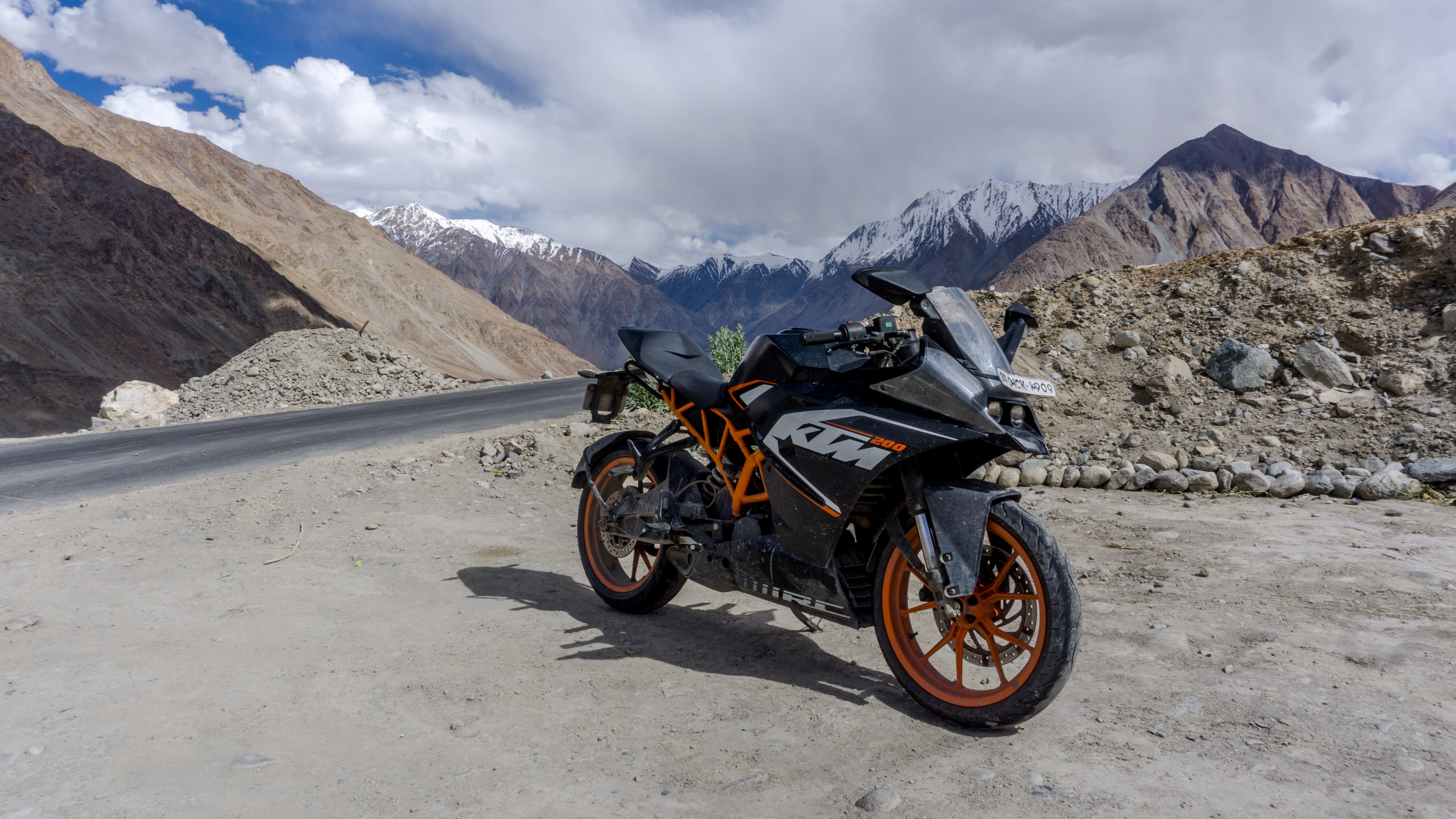 day, stationary, bike, environment, himalayas, land vehicle, travel, mountain, landscape, formation, snow, nubra valley, adventure, motorcycle, cloud - sky, HD Wallpaper