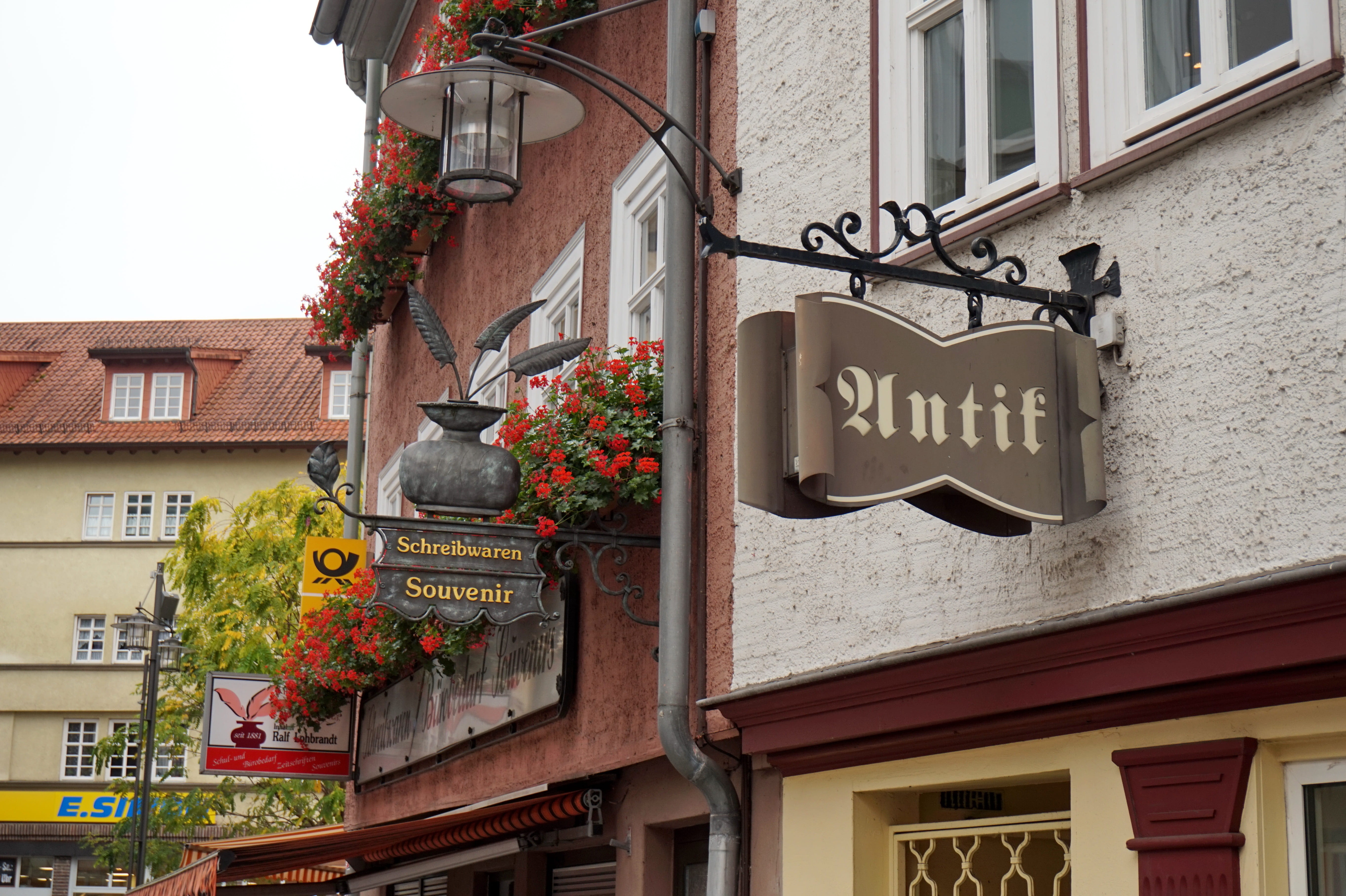 no people, residential district, sign, 5K, information, city, the main square, day, architecture, flower, hanging, building exterior, europe, low angle view, HD Wallpaper