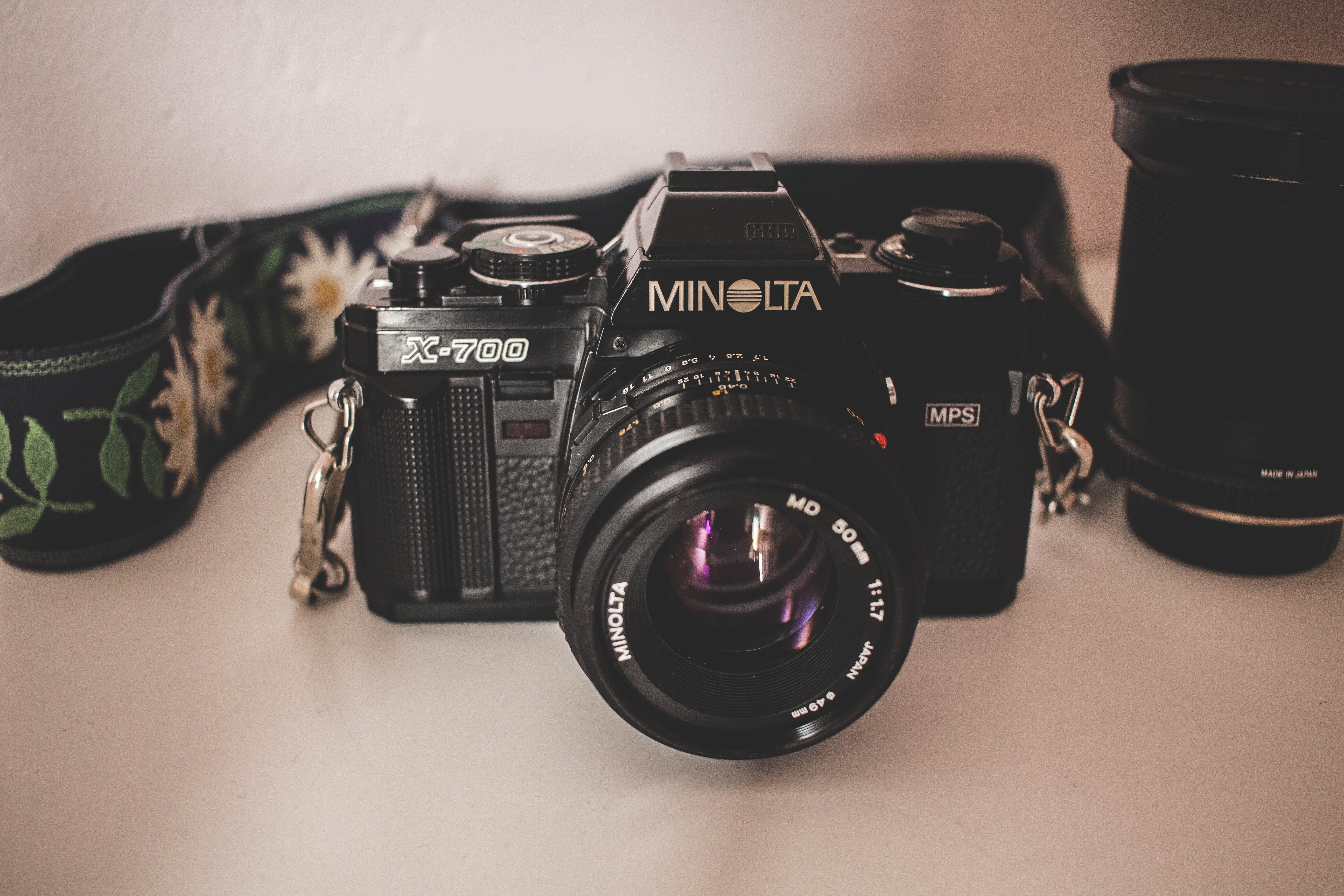 text, communication, photography themes, table, lens - optical instrument, no people, minolta, germany, arts culture and entertainment, 5K, photographic equipment, HD Wallpaper