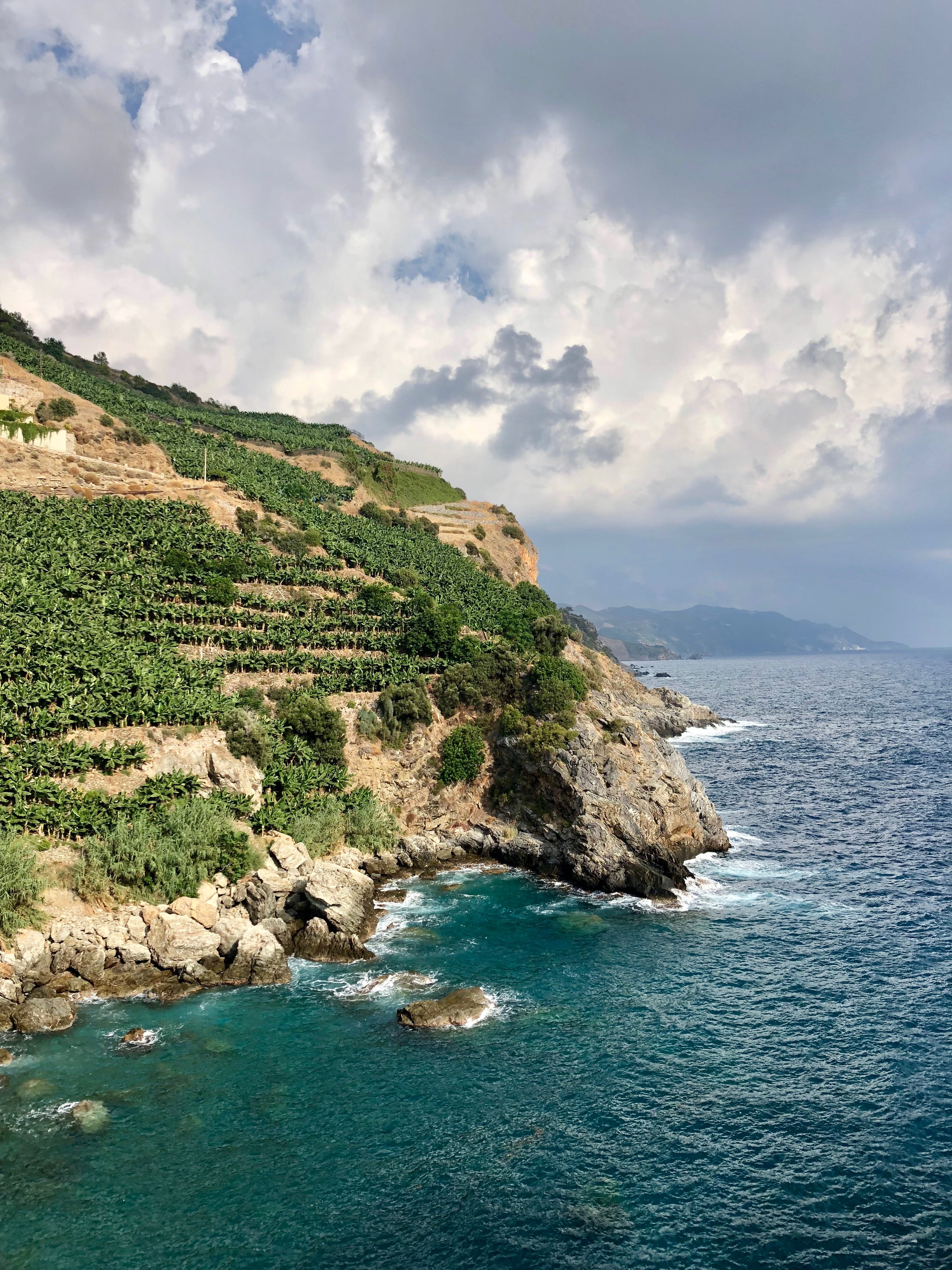 stones, cloudy sky, blue sky, rocky coast, rocky shore, cliffside, nature, clouds, sea water, coast, sunny, waterfront, rocky mountains, beauty in nature, Phone HD Wallpaper