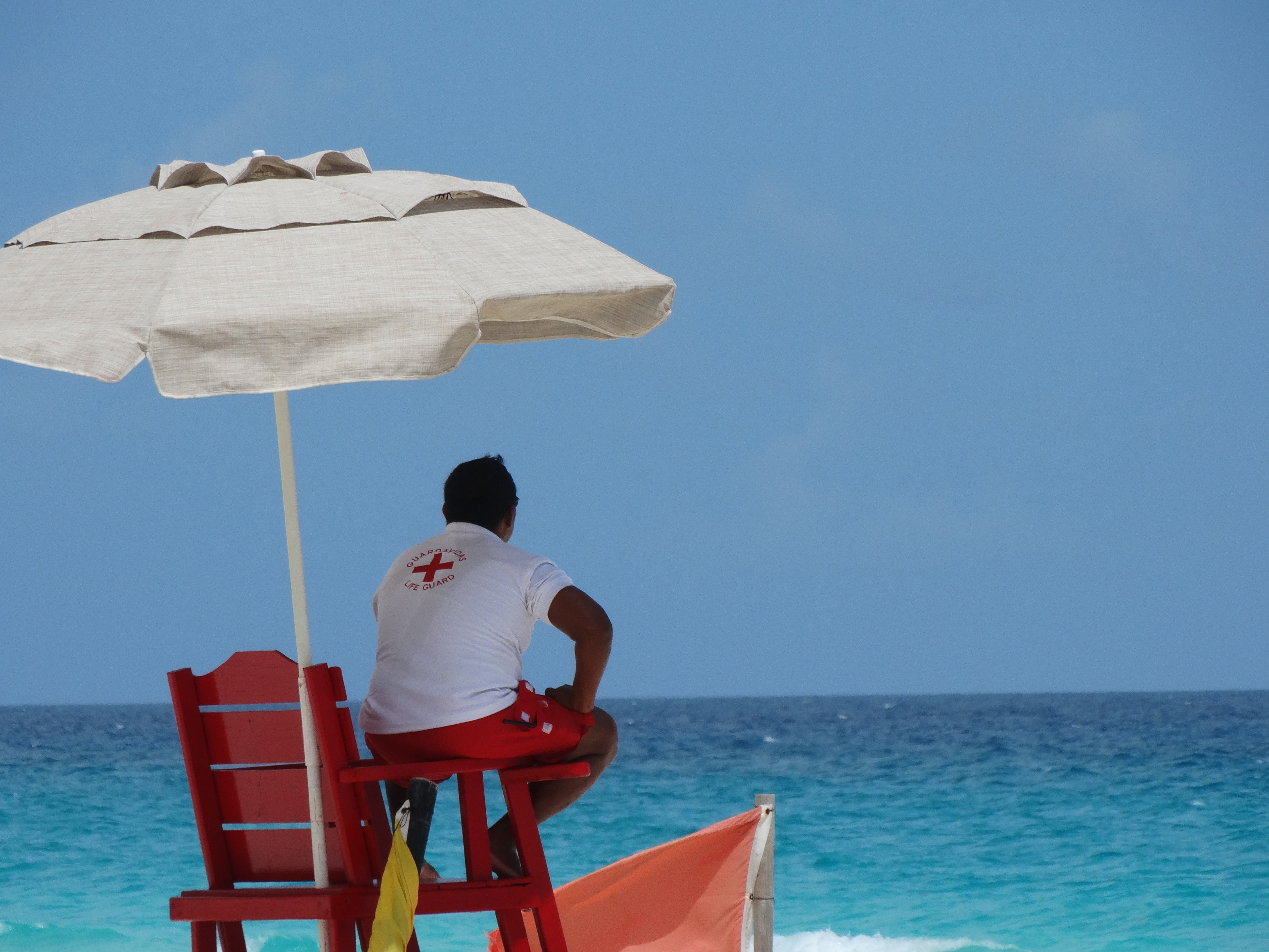 outdoors, rear view, security, life guard, day, nature, sky, cancun, seat, men, blue, observation, casual clothing, leisure activity, chair, water, horizon, HD Wallpaper