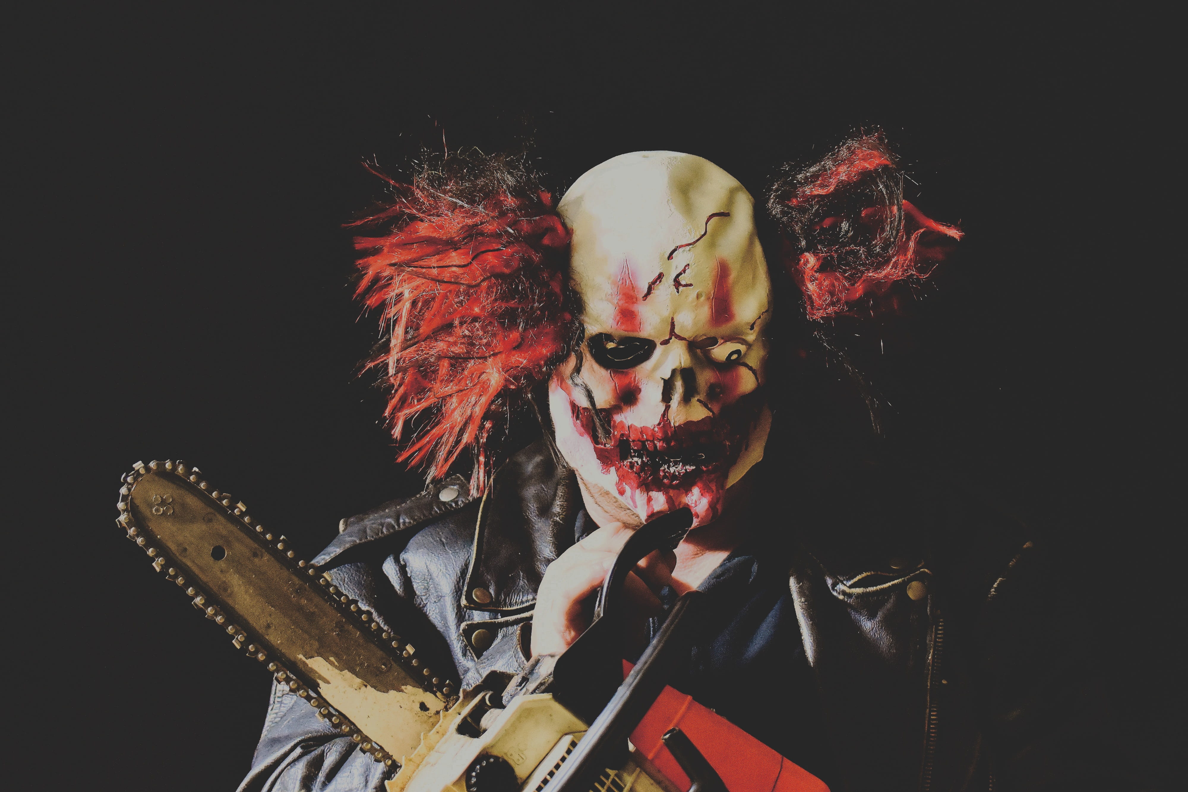 waist up, paint, chainsaw, front view, black background, looking at camera, leisure activity, make-up, men, mask, horror clown, face paint, creepy, 4K, HD Wallpaper