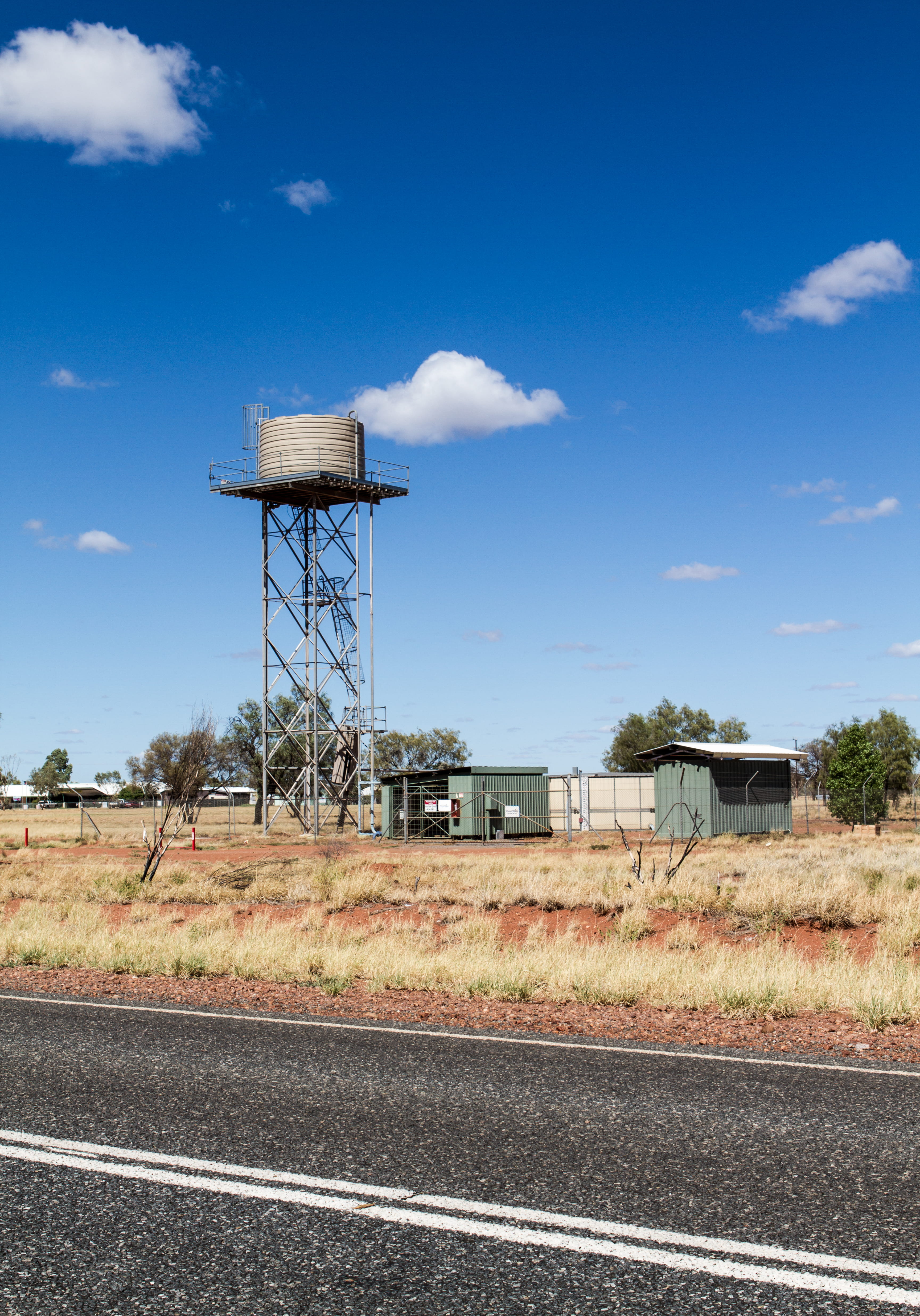 land, northern territory, metal, cloud, shed, nature, field, landscape, storage tank, rail transportation, transportation, tower, road, clouds, cloud - sky, Phone HD Wallpaper