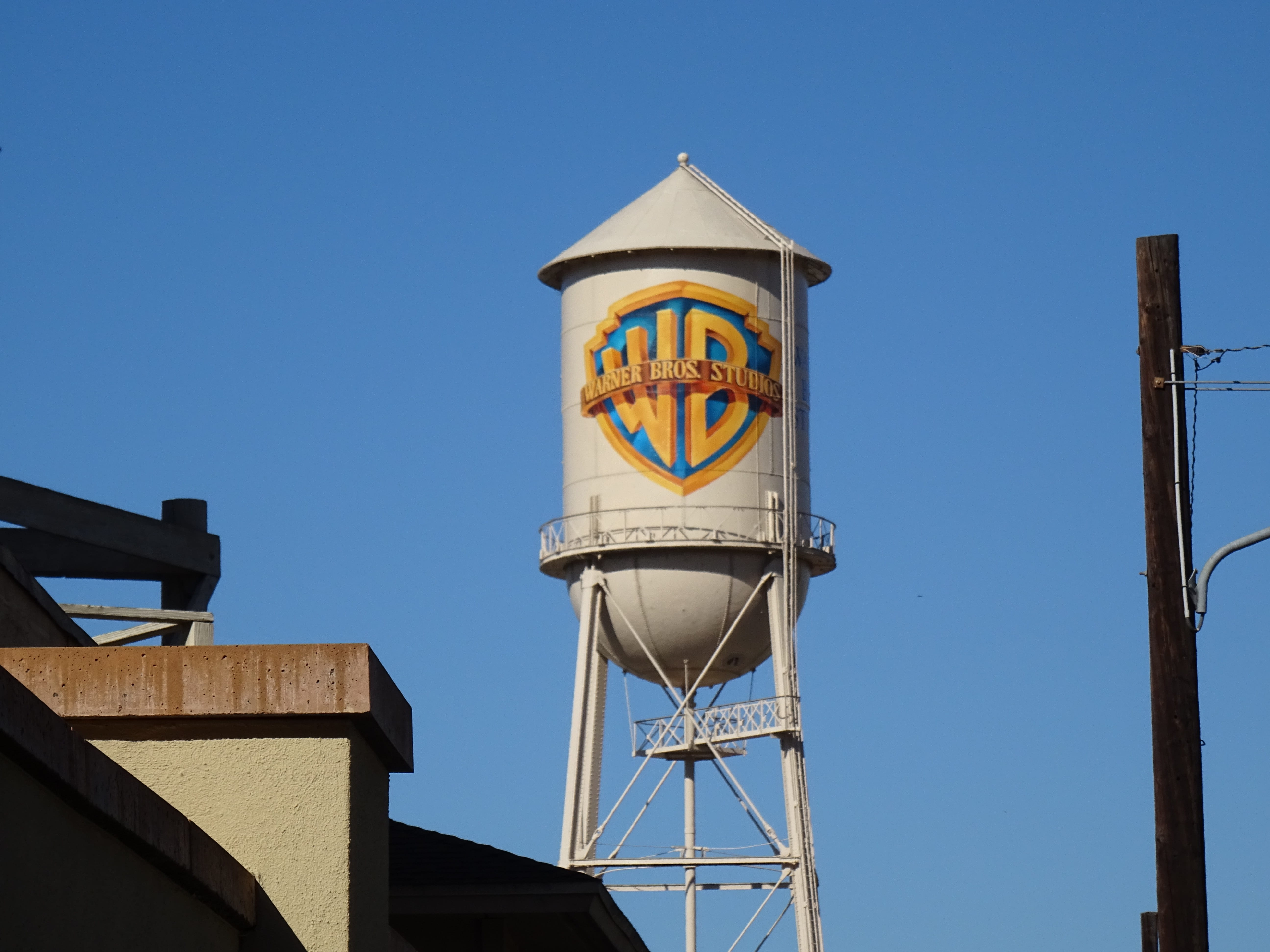 blue, 5K, Warner Bros, sunlight, communication, copy space, day, built structure, building exterior, outdoors, sky, low angle view, building, no people, HD Wallpaper