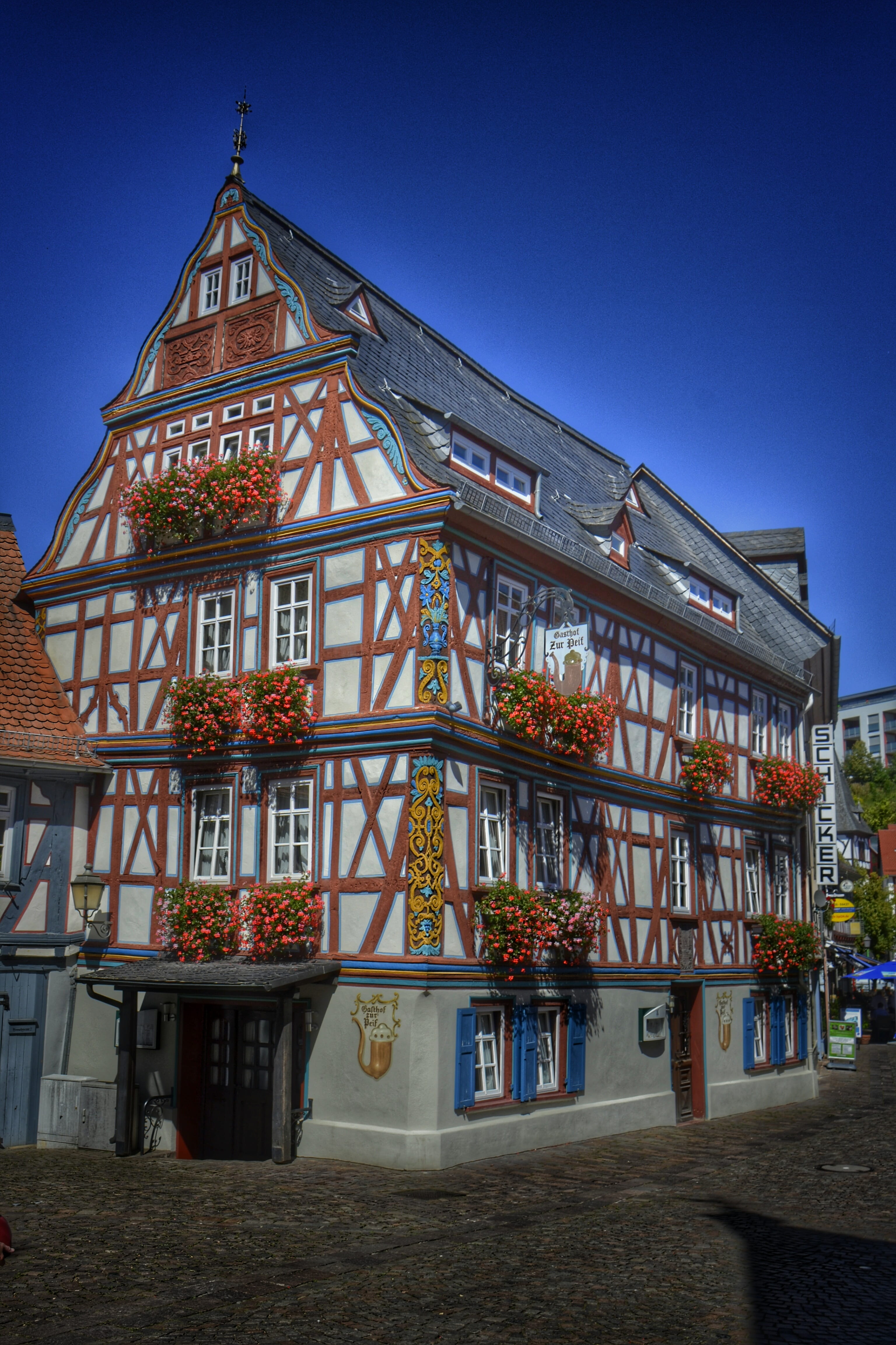 communication, low angle view, art, places of interest, blue, building, plant, clear sky, germany, nature, sunlight, day, flowers, building exterior, no people, Phone HD Wallpaper