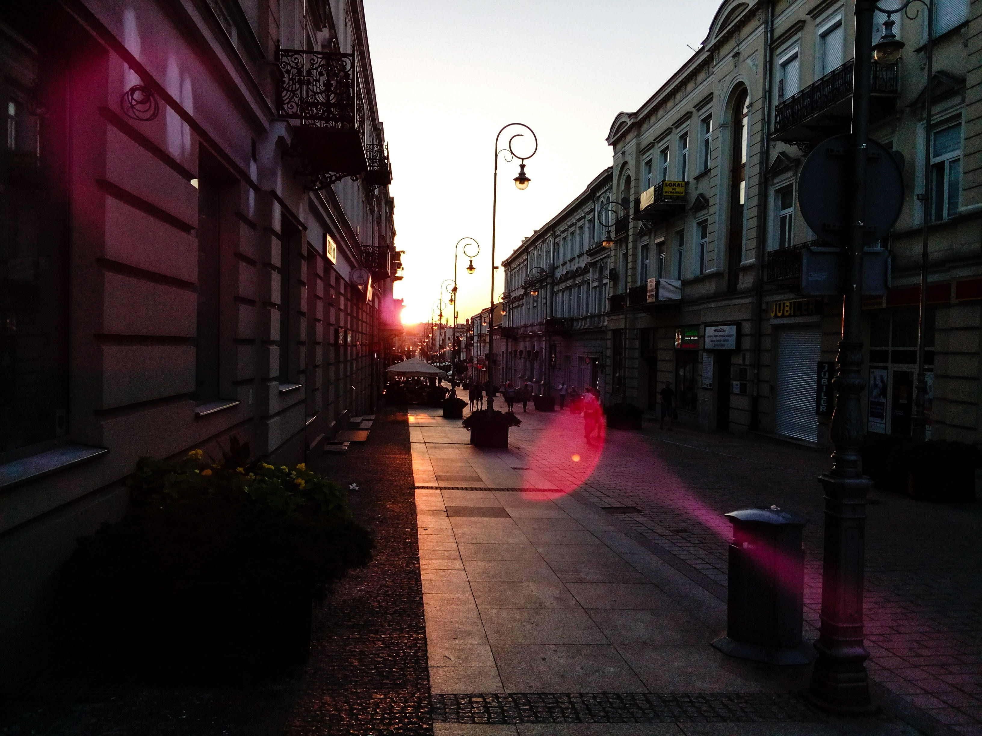glow, city street, summer, building, sunset, monument, sienkiewicz, street light, architecture, poland, the path, built structure, outdoors, sign, residential district, HD Wallpaper