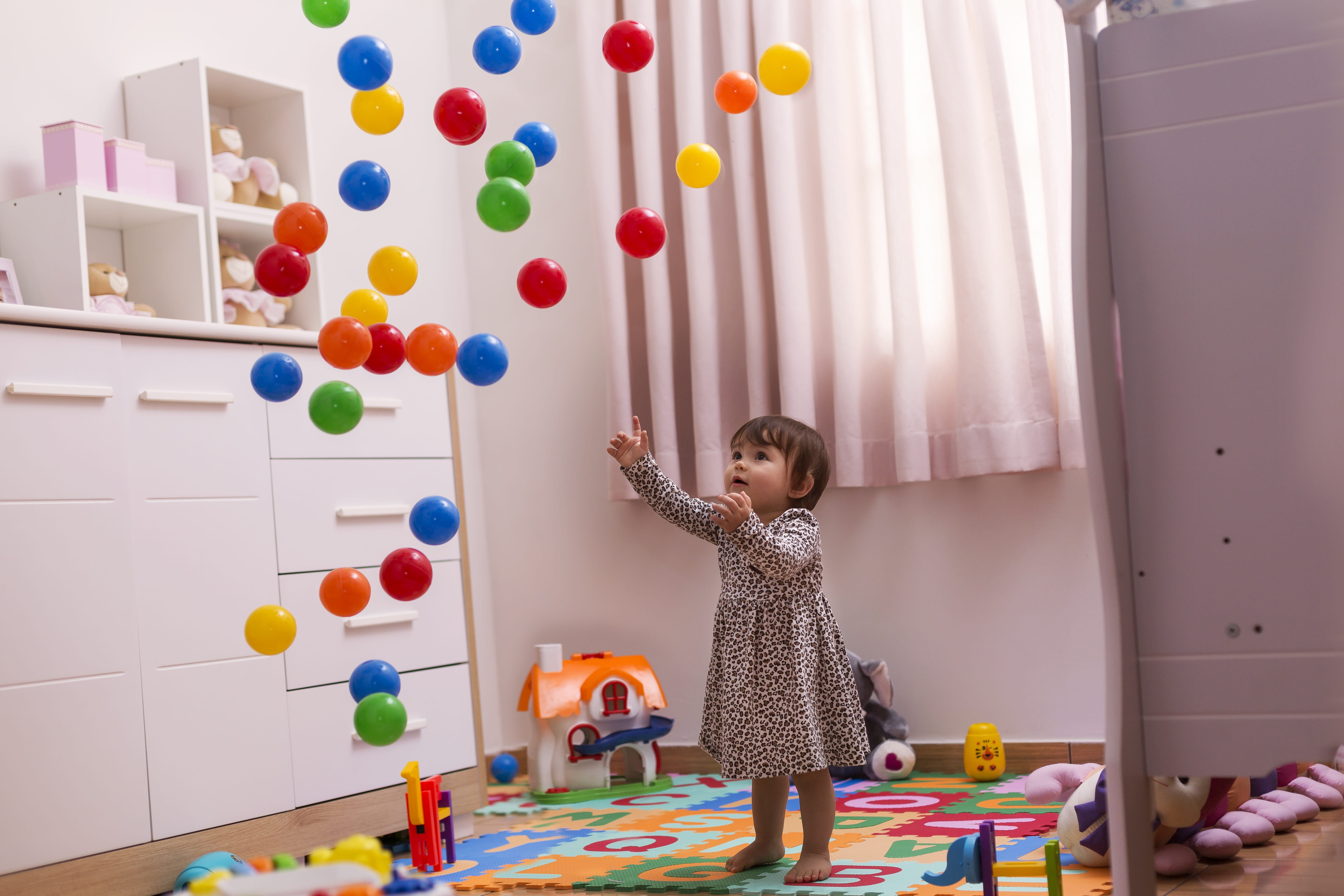 indoors, day, one person, 5K, childhood, colorful, enjoyment, girl, human limb, human arm, play, joy, toys, multi colored, offspring, child, balls, arms raised, HD Wallpaper