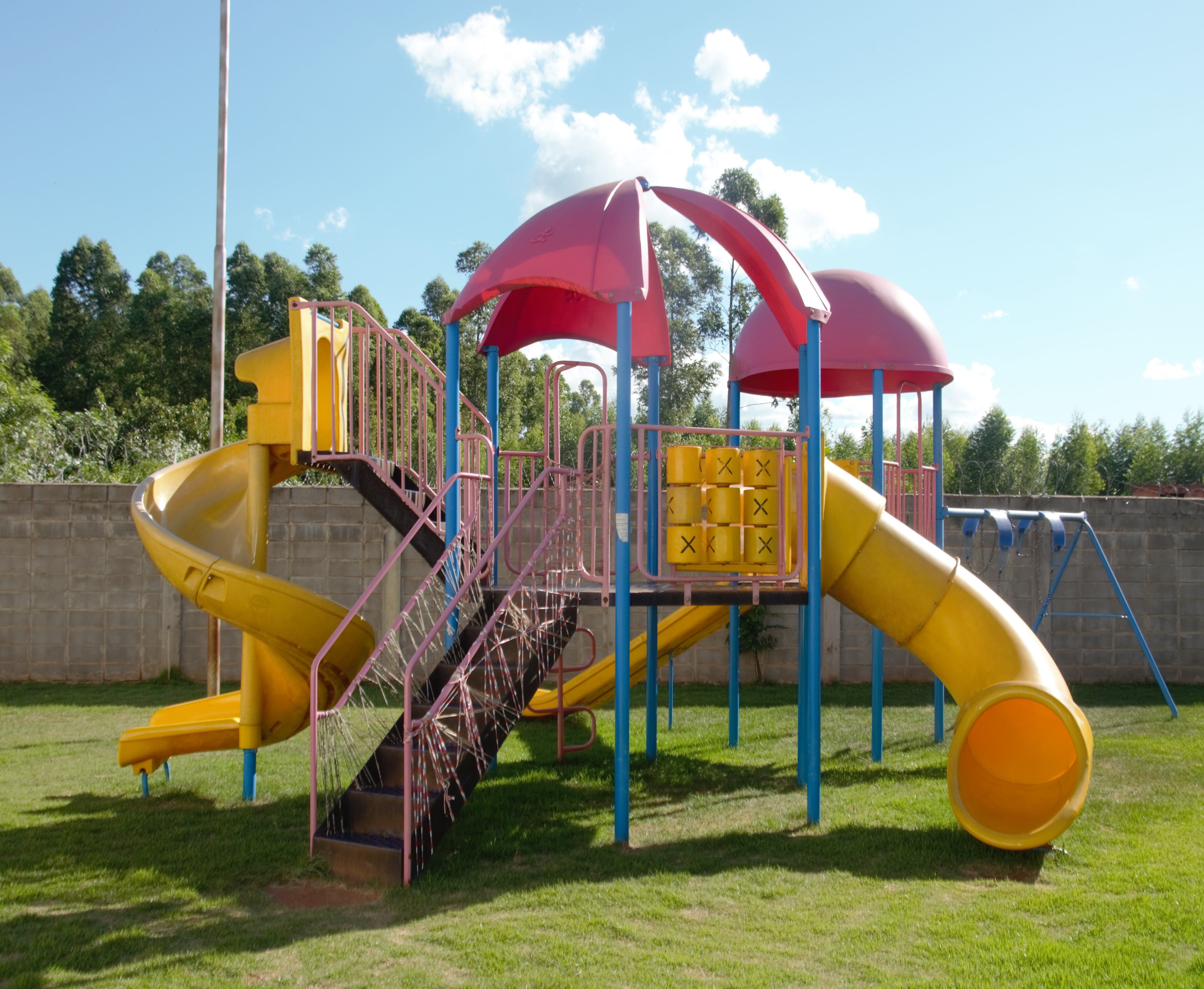 slide - Play Equipment, yellow, tree, children playing, 4K, sunlight, day, grass, outdoors, swing, childhood, jungle gym, Fun, playground, sports And Fitness, HD Wallpaper