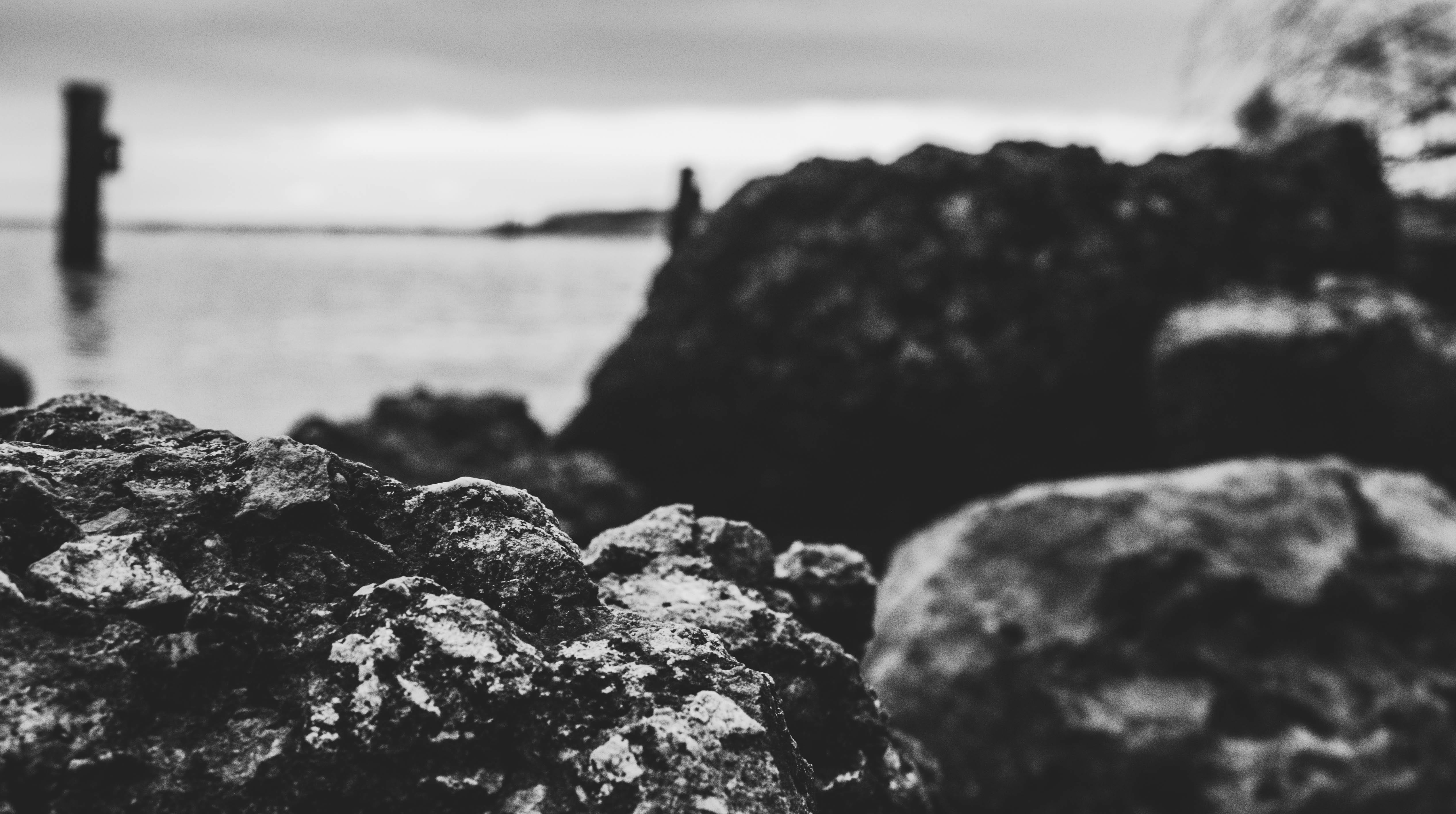 sea, rocks, ocean, rock, beach, seashore, day, tranquility, stone, focus on foreground, reflection, mountain, photo, close-up, selective focus, no people, HD Wallpaper