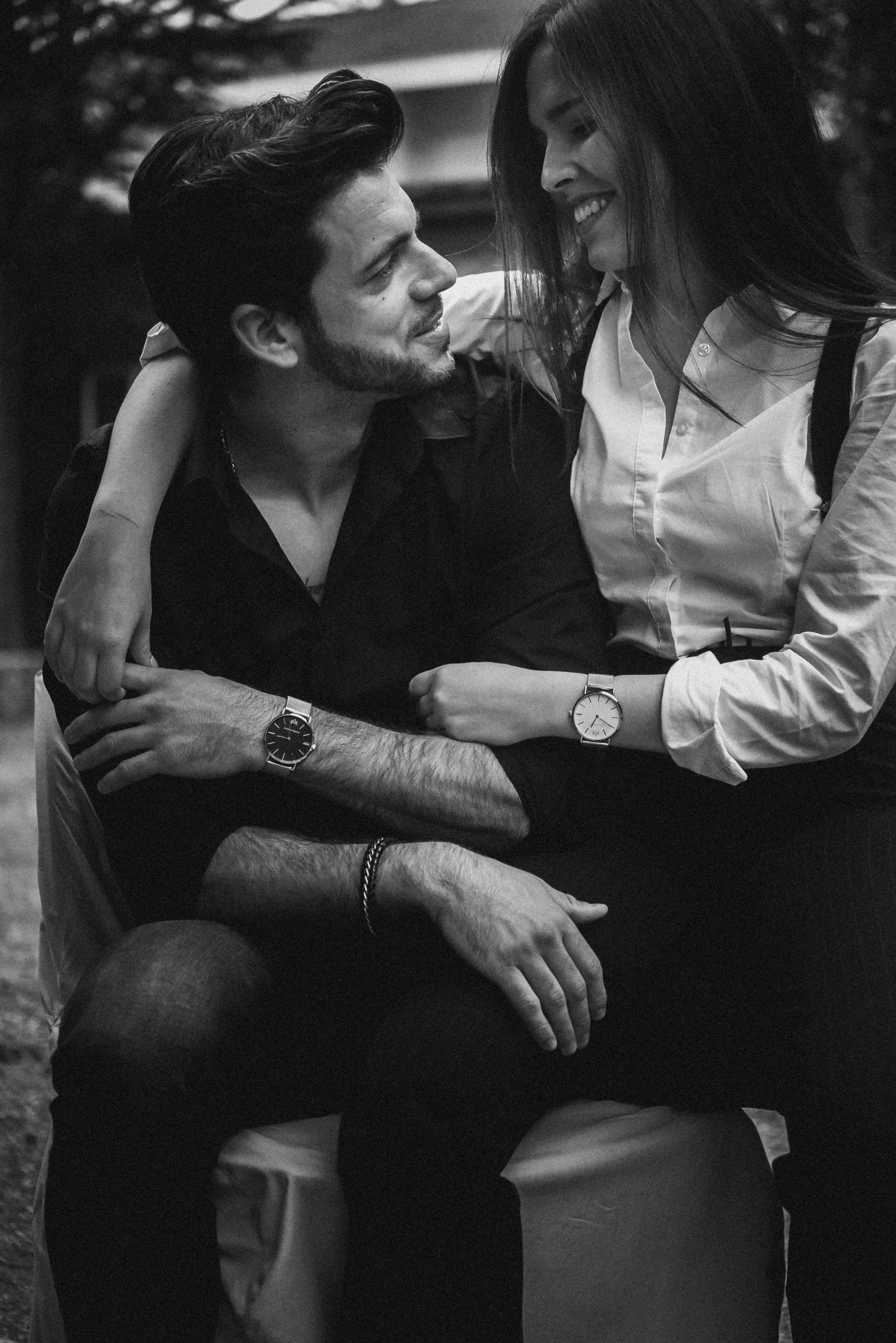 black, sitting, grayscale, two people, undershirt, couple - relationship, happiness, people, furniture, leisure activities, wristwatch, looking, couch, Phone HD Wallpaper