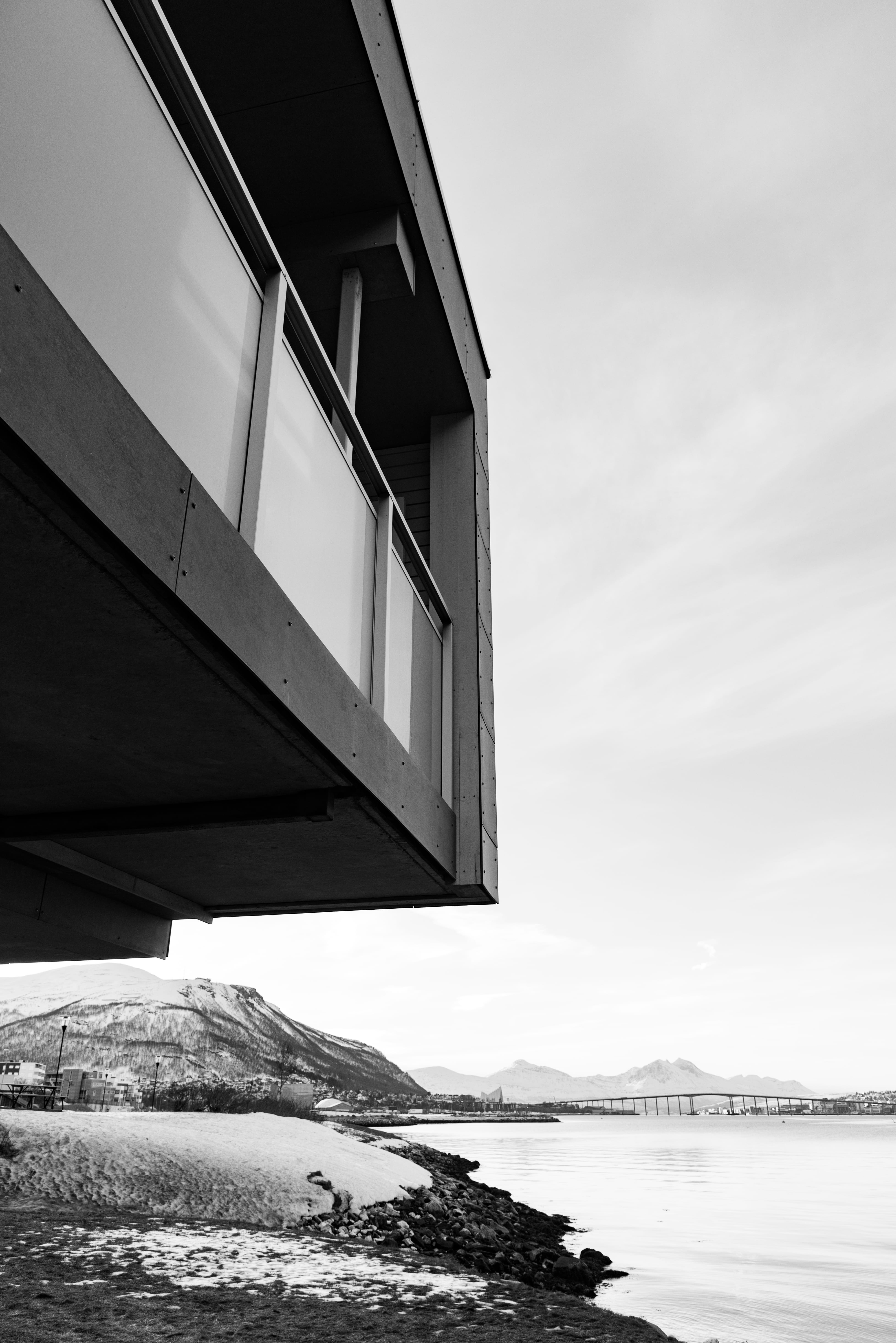 water, day, beauty in nature, beside, cold temperature, building exterior, building, black and white, sea, architecture, apartment, winter, gray, ocean, Phone HD Wallpaper