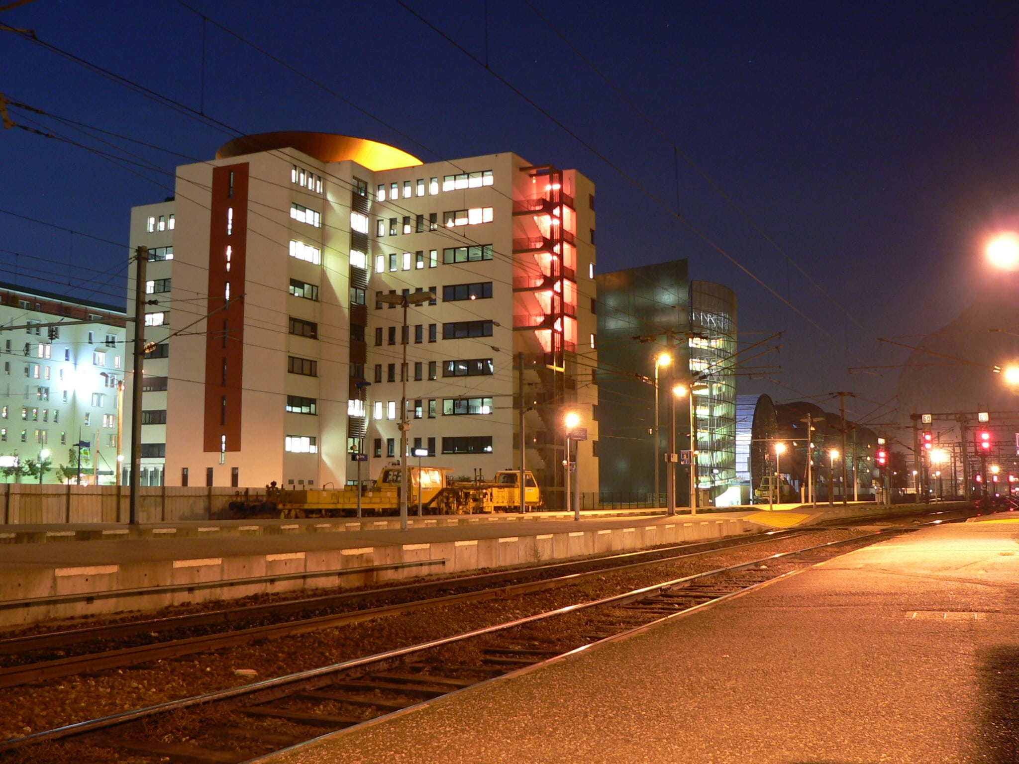 city life, sky, no people, office building exterior, railroad track, illuminated, isère, street light, light, night, train, building exterior, mode of transportation, HD Wallpaper