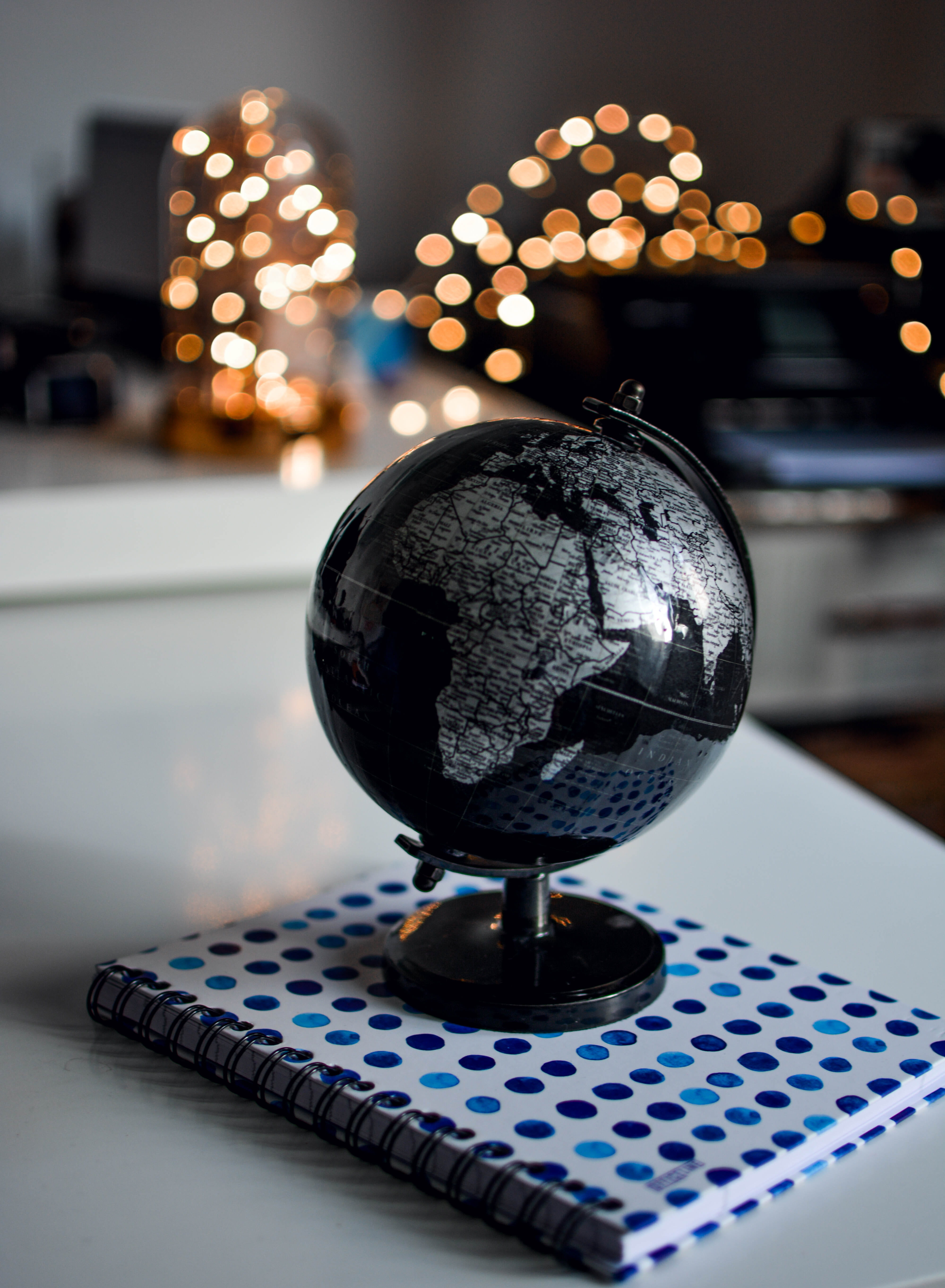5K, education, ball-shaped, metal, focus on foreground, no people, shape, black, desk, still life, globe, object, sphere, notebook, crystal ball, circle, Phone HD Wallpaper