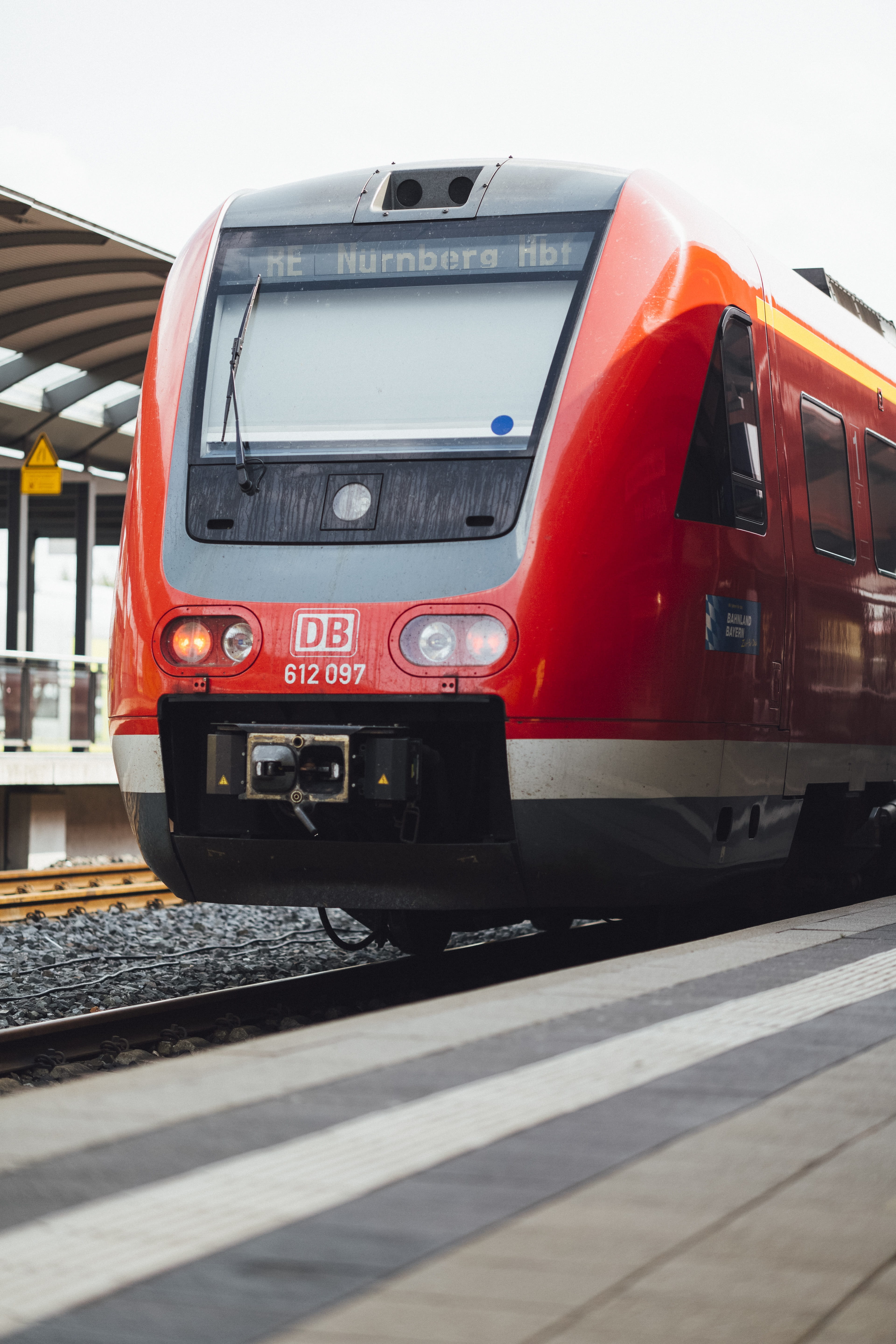 railway station, architecture, upper franconia, railroad station, outdoors, train, sunlight, db, train - vehicle, red, city, away, track, rails, mode of transportation, Phone HD Wallpaper