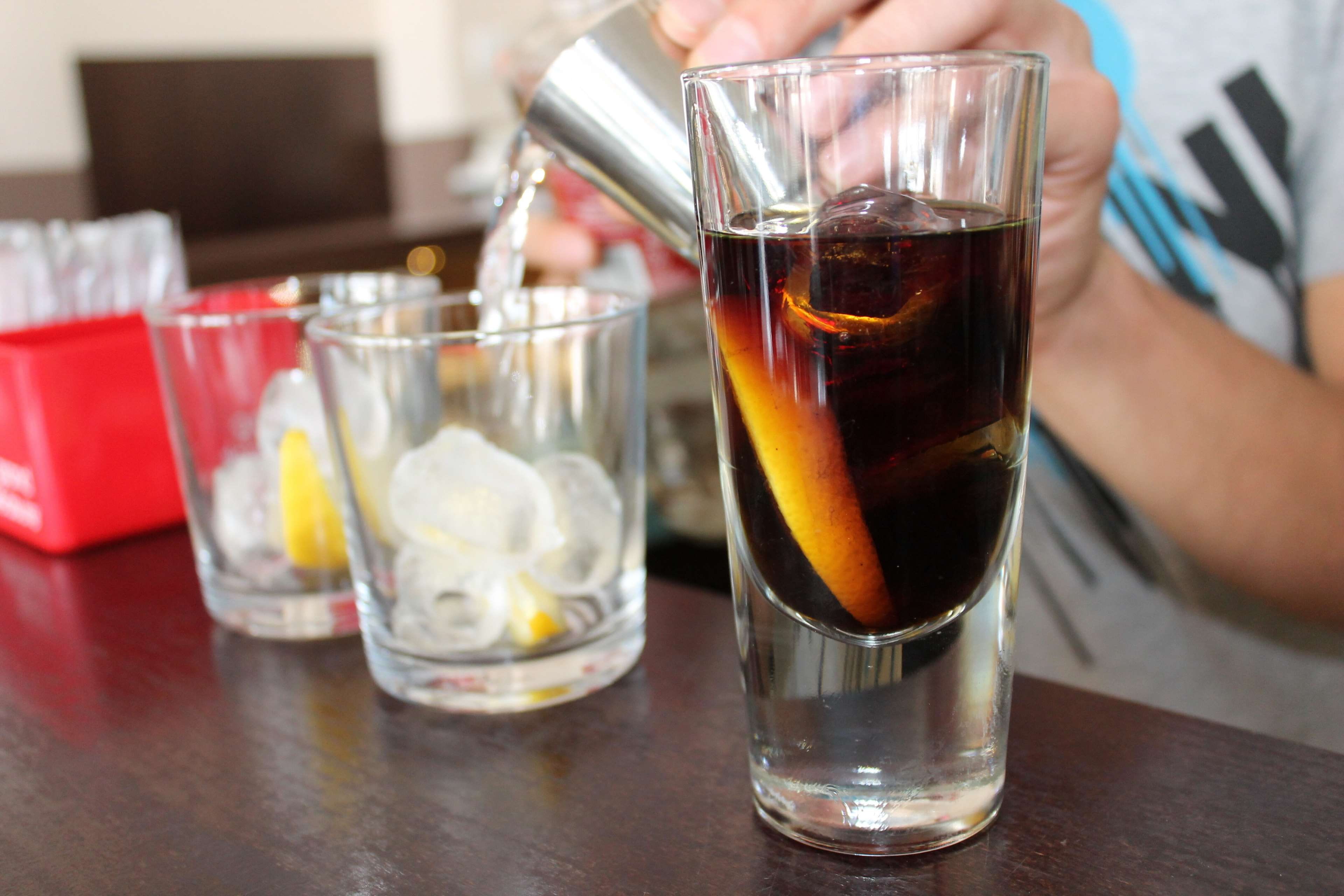 human hand, glass, indoors, bar, 4K, drink, table, barman, adult, close-up, cocktail, midsection, focus on foreground, food, one person, holding, pitcher - jug, HD Wallpaper