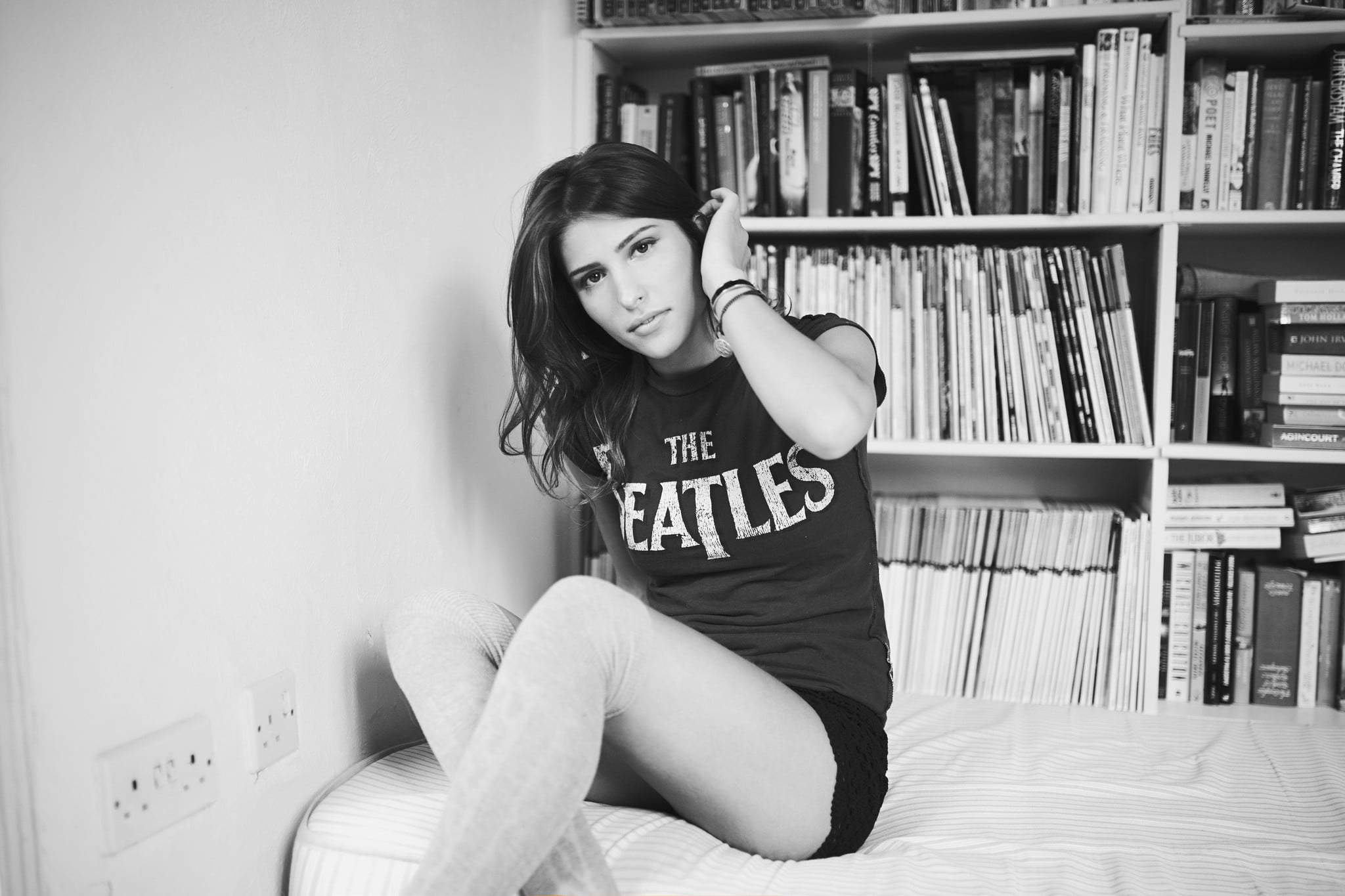looking at viewer, sitting, full length, bookshelf, home interior, The Beatles, young women, one person, young adult, hands in hair, lifestyles, child, HD Wallpaper