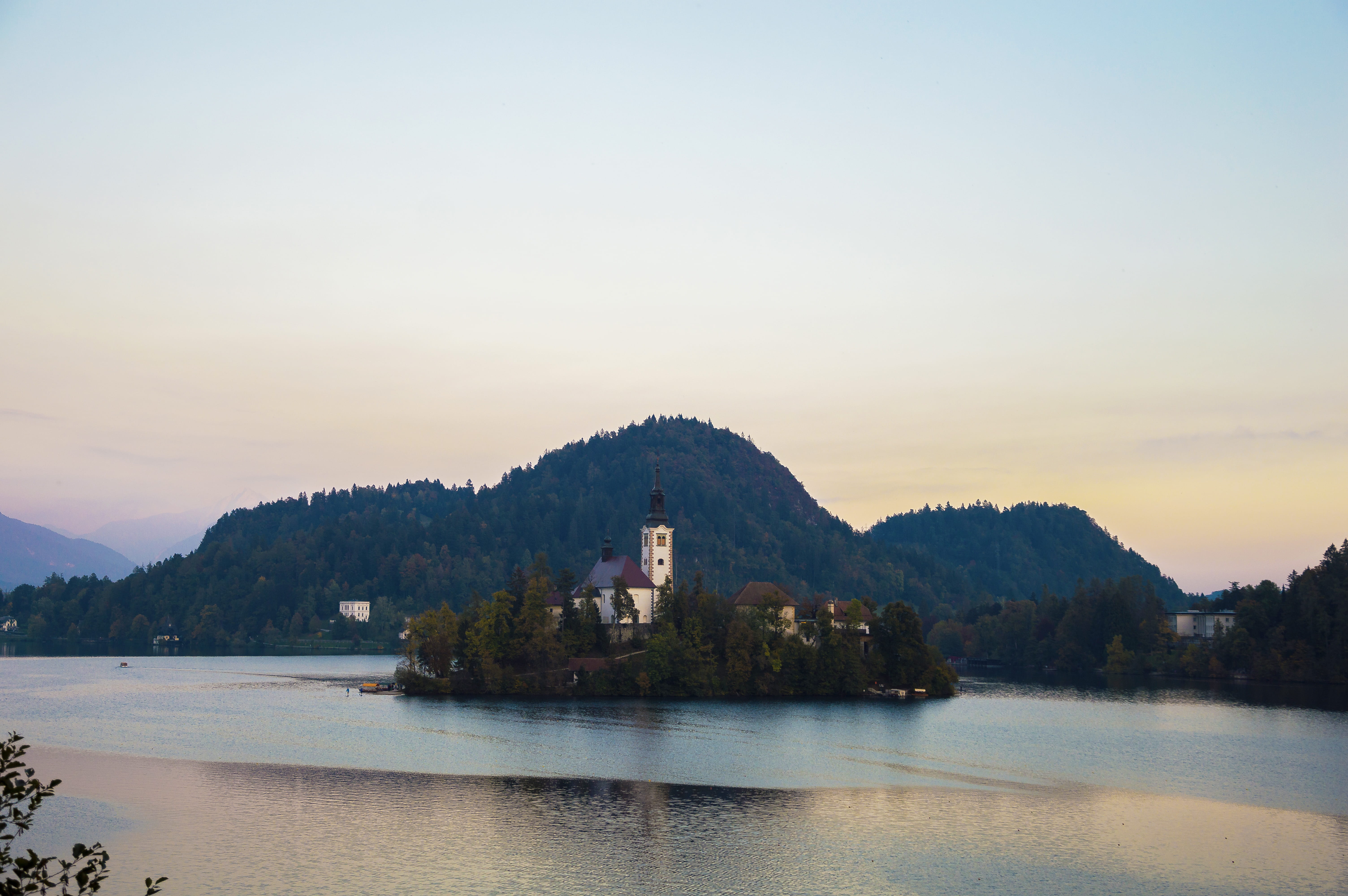 no people, tranquility, island, lake, outdoors, beauty in nature, landmark, sunset, land, building, coast, shoreline, journey, architecture, mountain range, HD Wallpaper